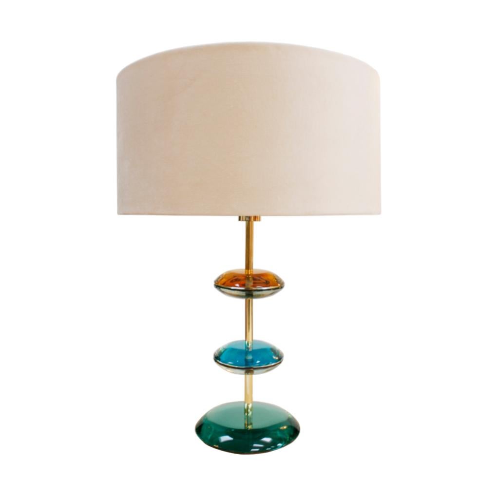 Pair of table lamps designed by L.A. Studio. Structure made of solid brass with Murano colored glass pieces.
Manufactured in Italy.
Circular grey cotton velvet lampshades with gold inners.

Dimensions of the structure: 22 x 22 x 51