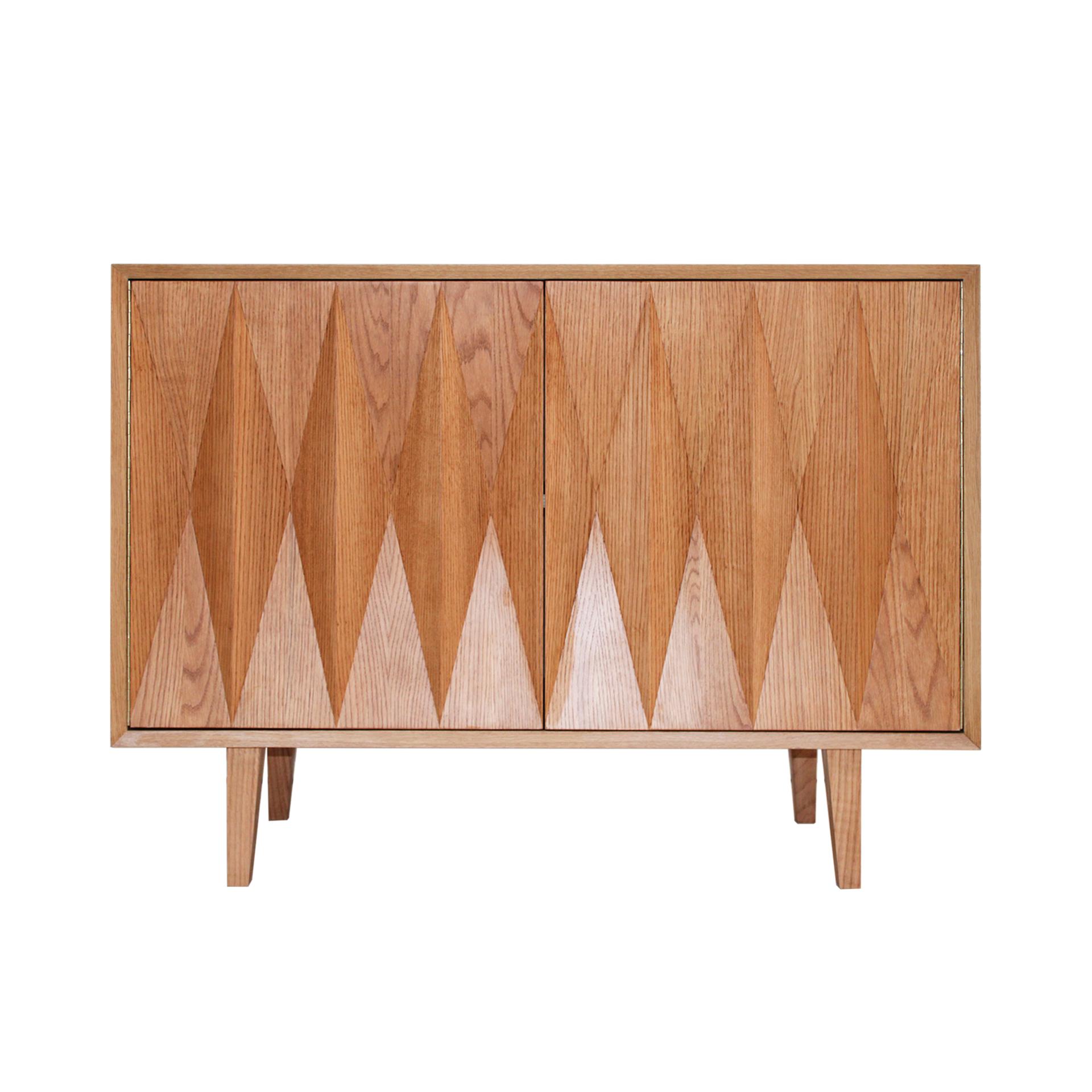 Pair of sideboards consisting of two doors and shelf inside. Handmade in oak wood, with geometric decoration on the front and wooden legs. Interior in oak wood. 

Our main target is customer satisfaction, so we include in the price for this item