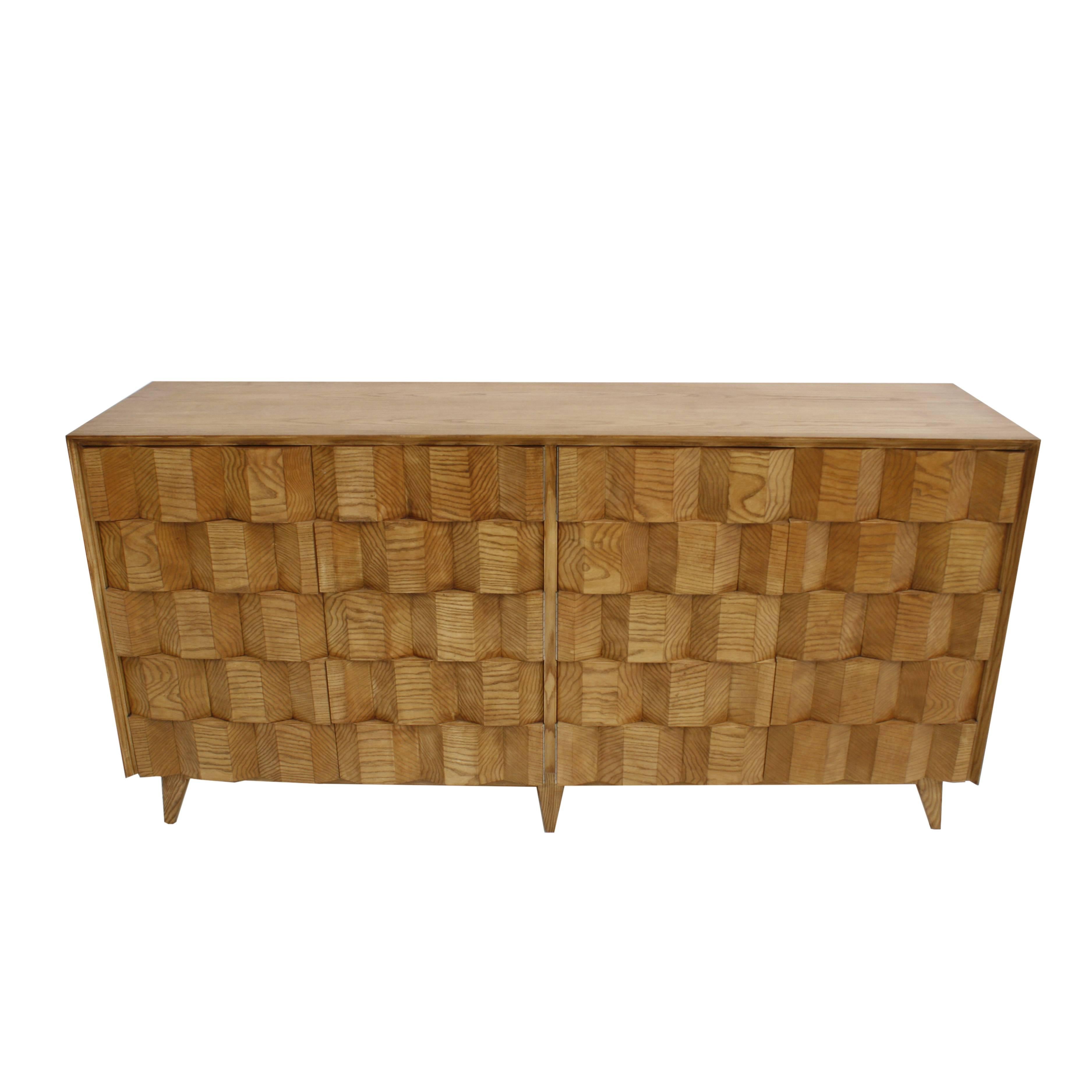 Contemporary faceted Italian sideboard designed by L.A. Studio. Structure made of solid oakwood. Composed of four folding doors with two glass shelves inside. Manufactured in Italy.



 