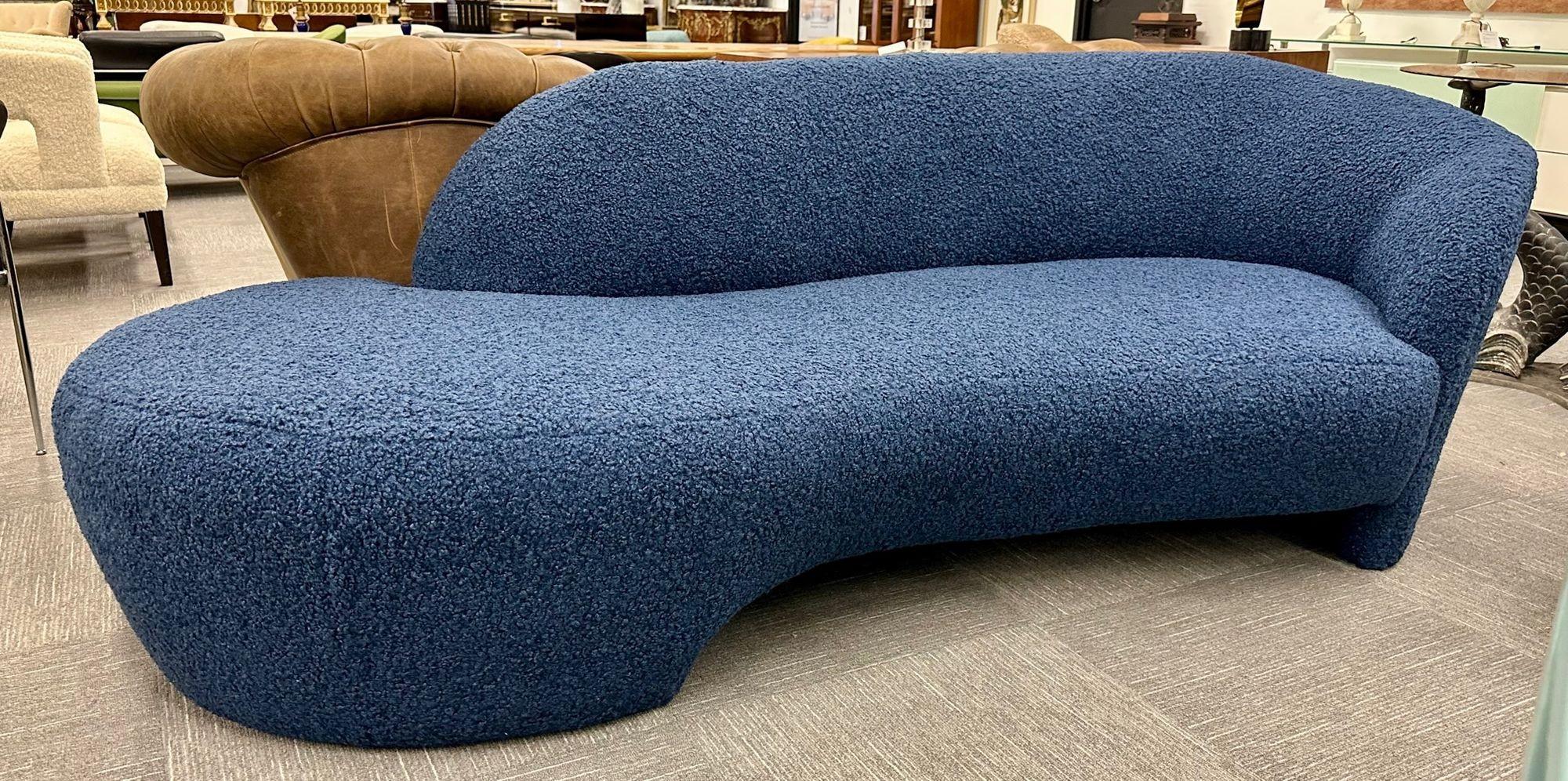 Mid-Century Modern style organic form kidney shaped cloud sofa, blue boucle.
Modern cloud shaped sofa newly upholstered in a cozy blue boucle fabric. 
Seat height: 17.5 inches.