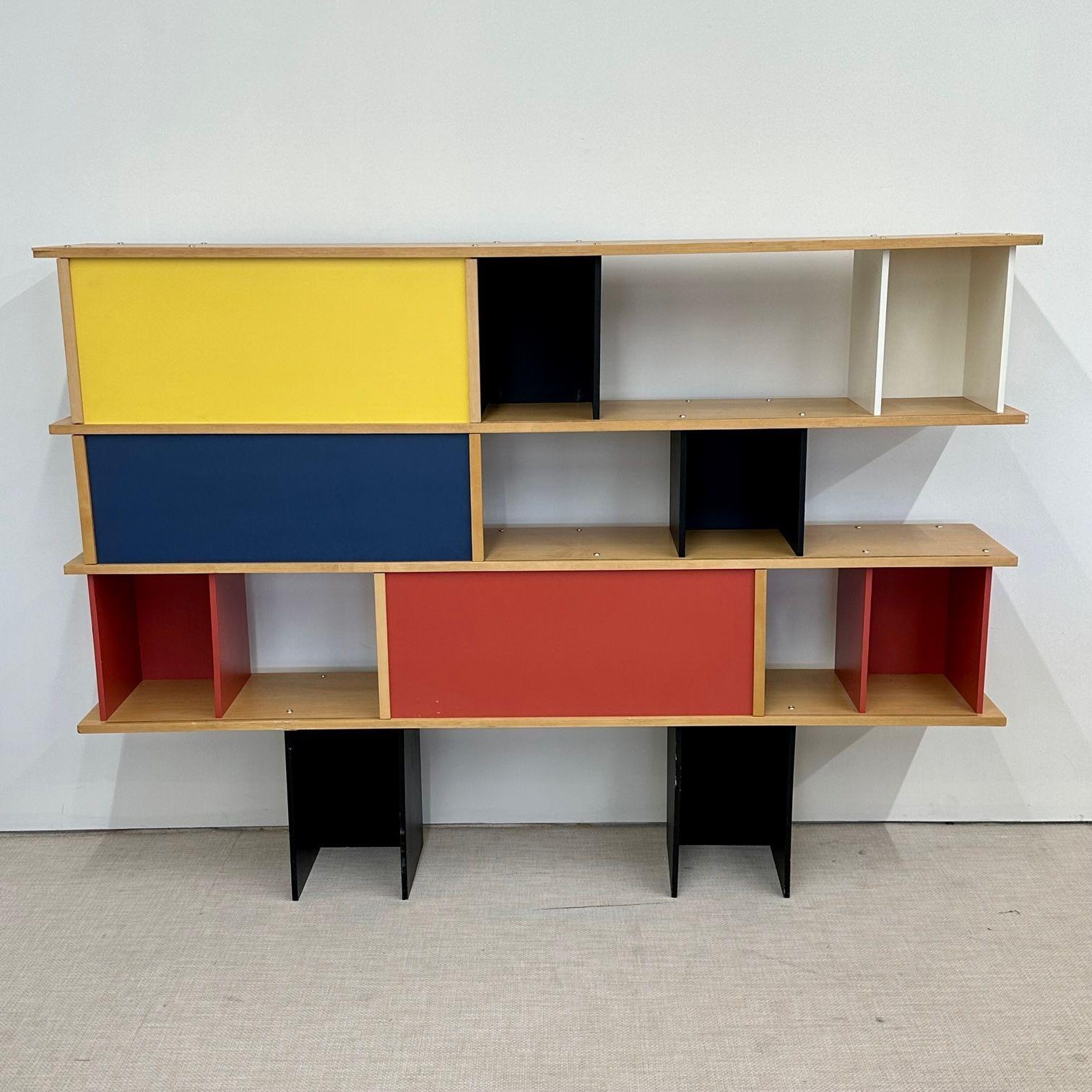 Mid-Century Modern style shelving unit, bookcase, Manner Perriand, room divider.
 
Colorful modern shelving unit, bookcase, or room divider having modular storage spaces with two sliding doors. This unit can both stand on the floor or be mounted