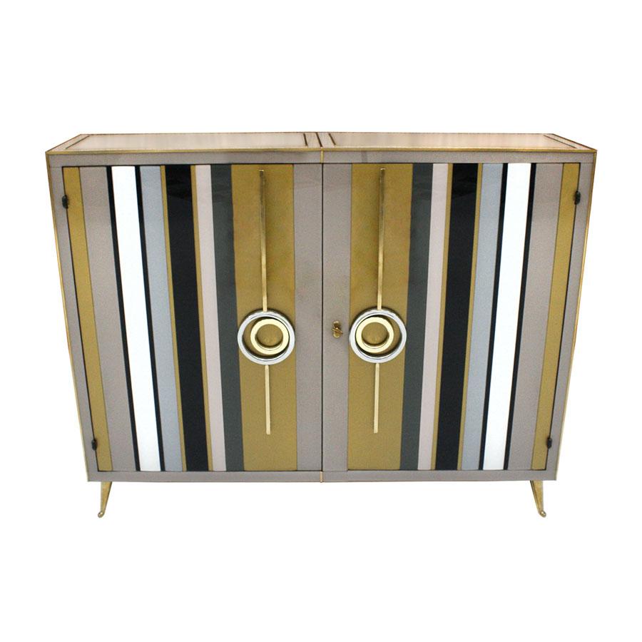 Mid-Century Modern style commode composed of two folding doors and one shelve inside. Structure made of solid wood covered with colored glass. Legs, handles and profiles are made of solid brass.