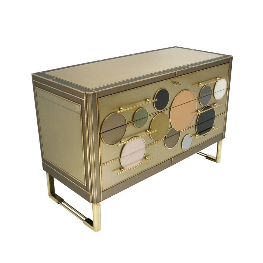 Italian commode composed of three drawers, made of solid wood structure covered with colored glass. Legs and handles made of solid brass.

Our main target is customer satisfaction, so we include in the price for this item professional and custom
