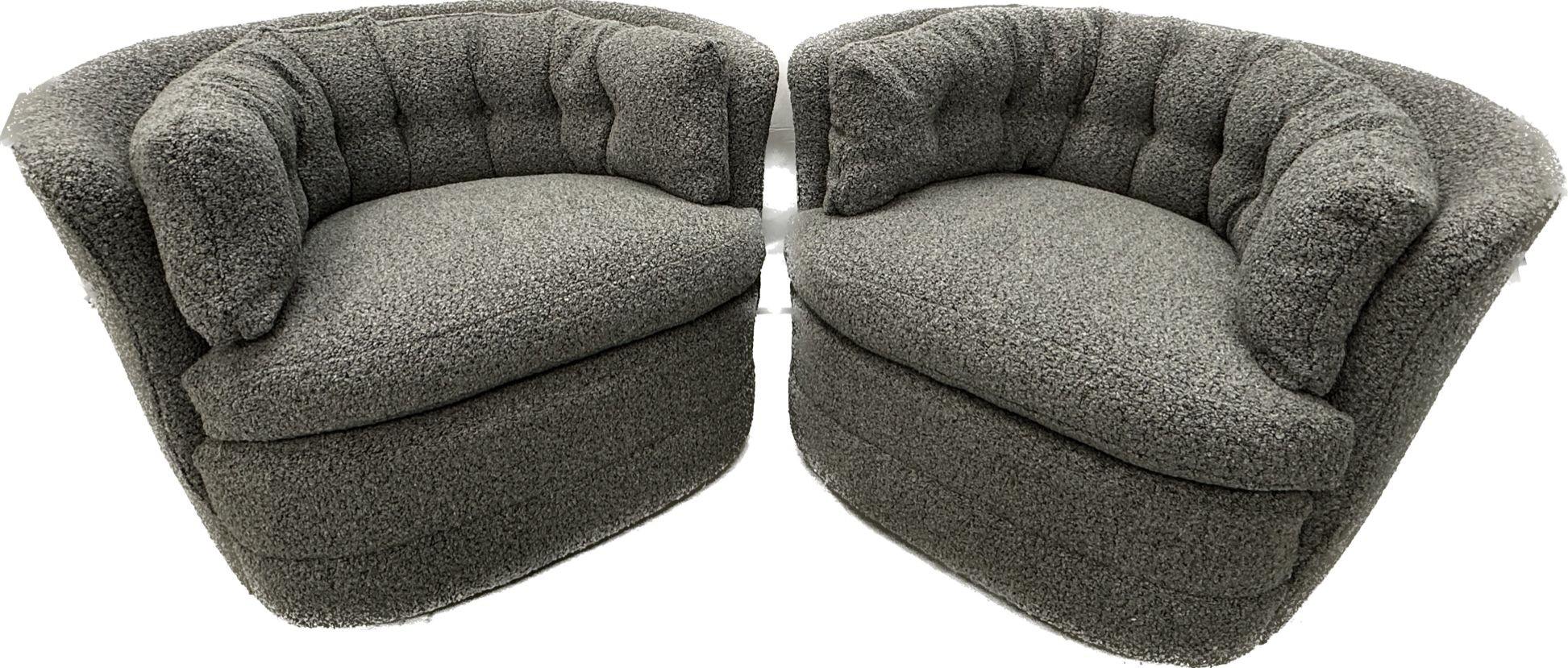 Mid-Century Modern style swivel, rolling lounge chairs, Baughman style, Boucle
Comfortable mid-century style rolling swivel chairs newly upholstered in a luxurious nubby gray boucle fabric. Having removable seat and back cushions. Each chair has a