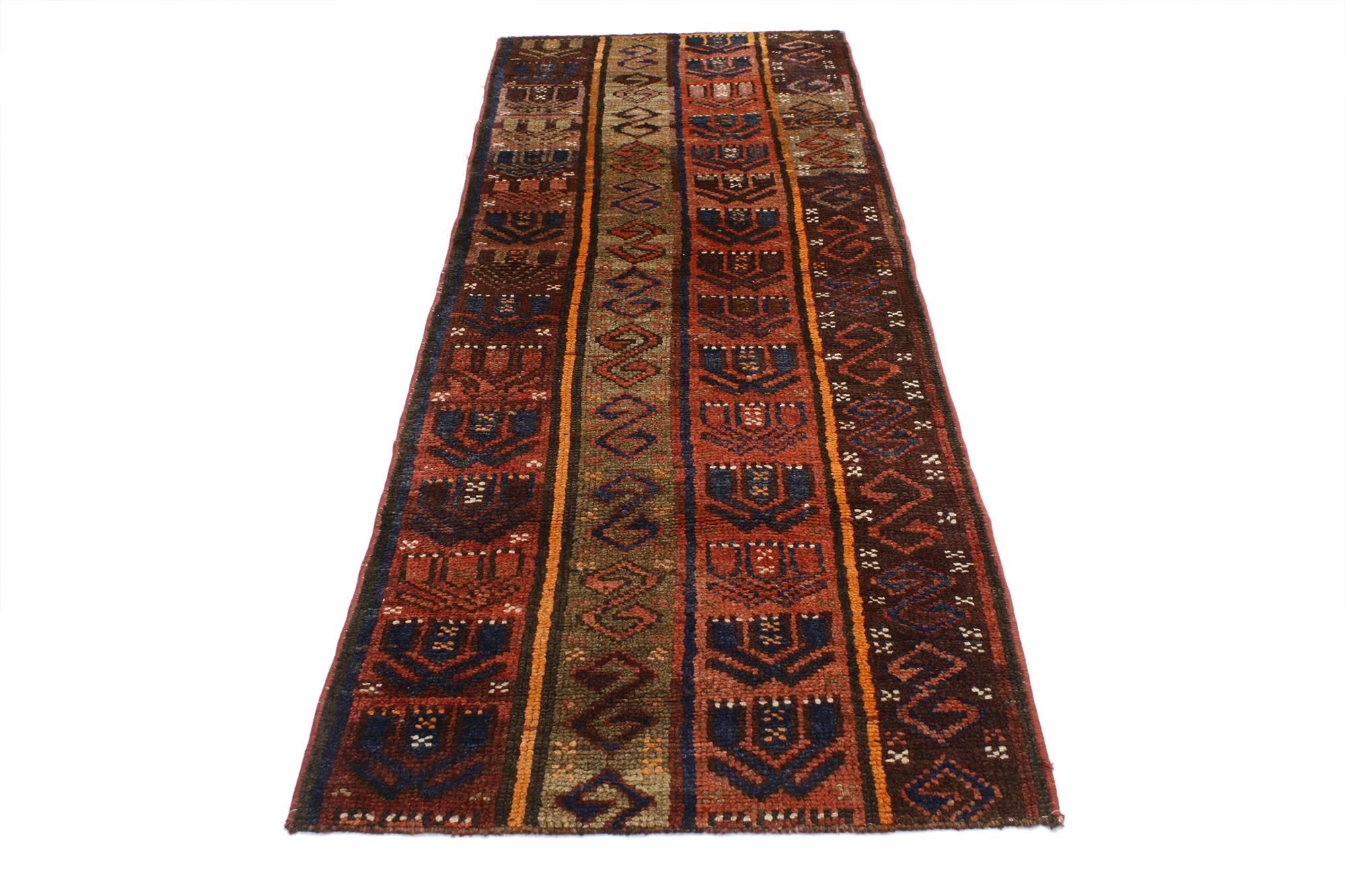 52105, Mid-Century Modern style vintage Turkish Oushak runner. Imbued with ancient symbolism and emanating tribal style, this midcentury Turkish Oushak runner features a rich display of color and pattern. S- shapes and hand of Fatima motifs appear