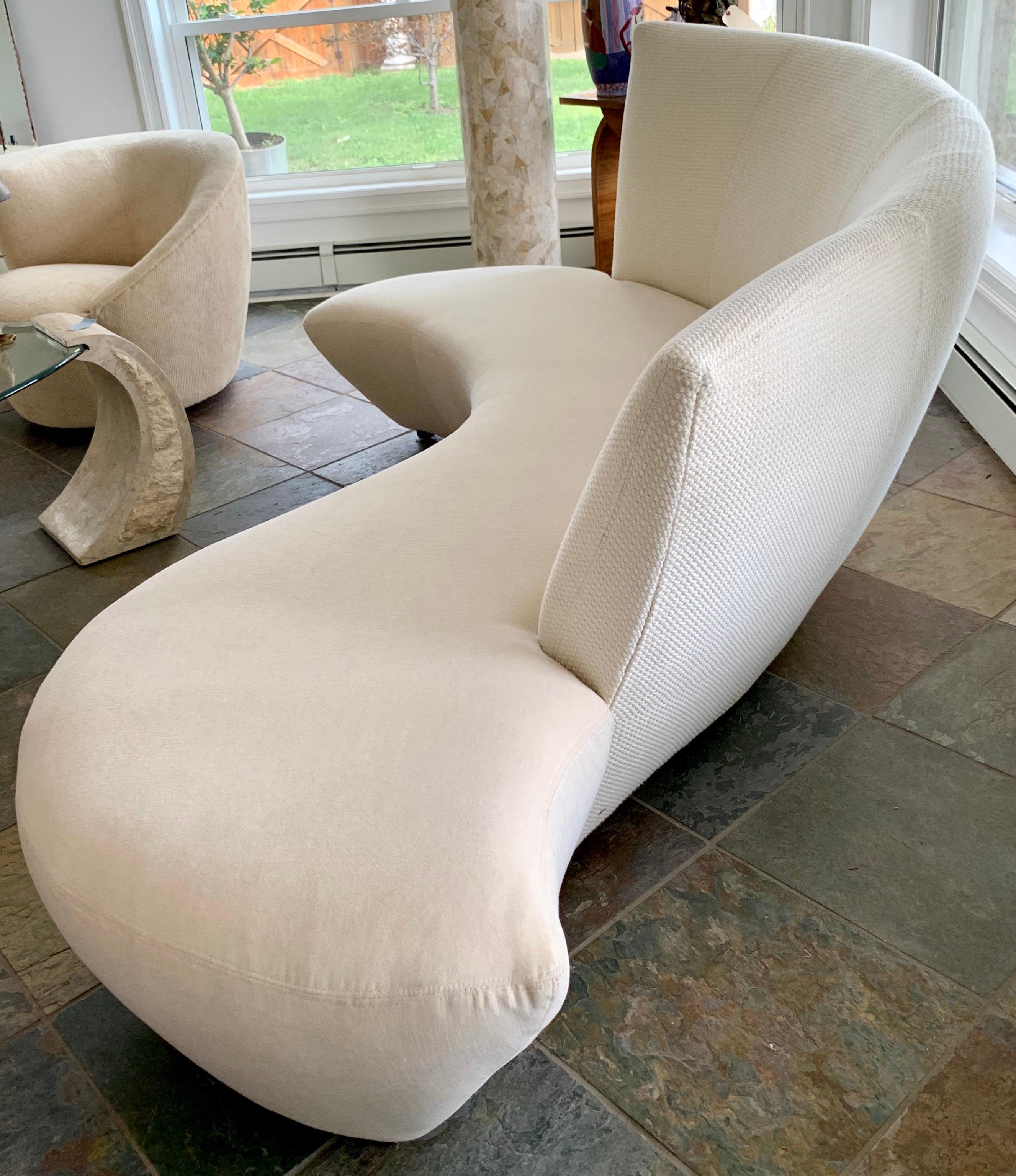 A sculptural modern sofa designed by Vladimir Kagan and inspired by the curves and undulations of the Guggenheim Museum in Bilbao Spain. It was newly reupholstered last year and is stunning. Rare to see a serpentine Kagan sofa in such good condition