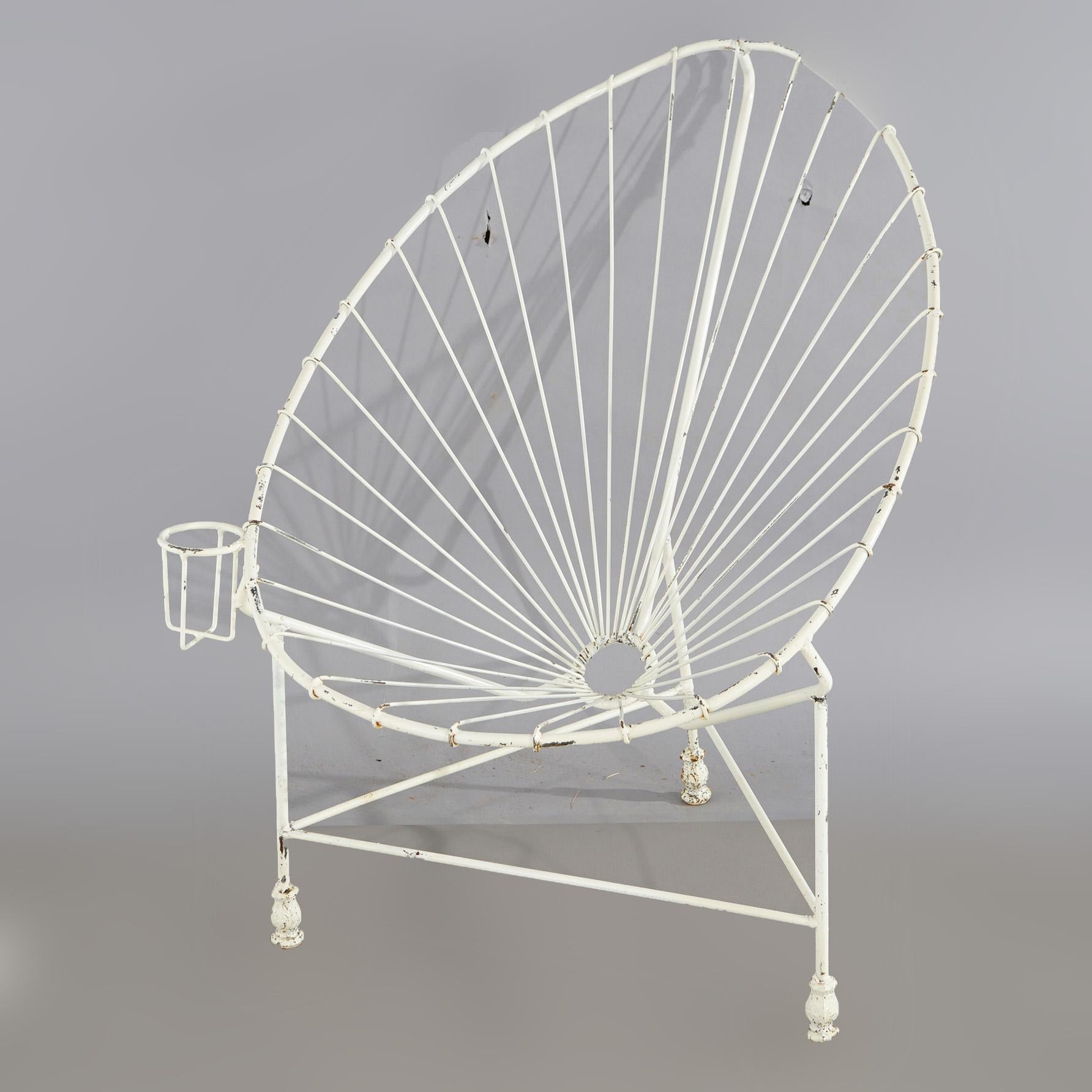 A Mid Century Modern egg garden chair offers painted wire construction with beverage holder, 20th century

Measures - 36