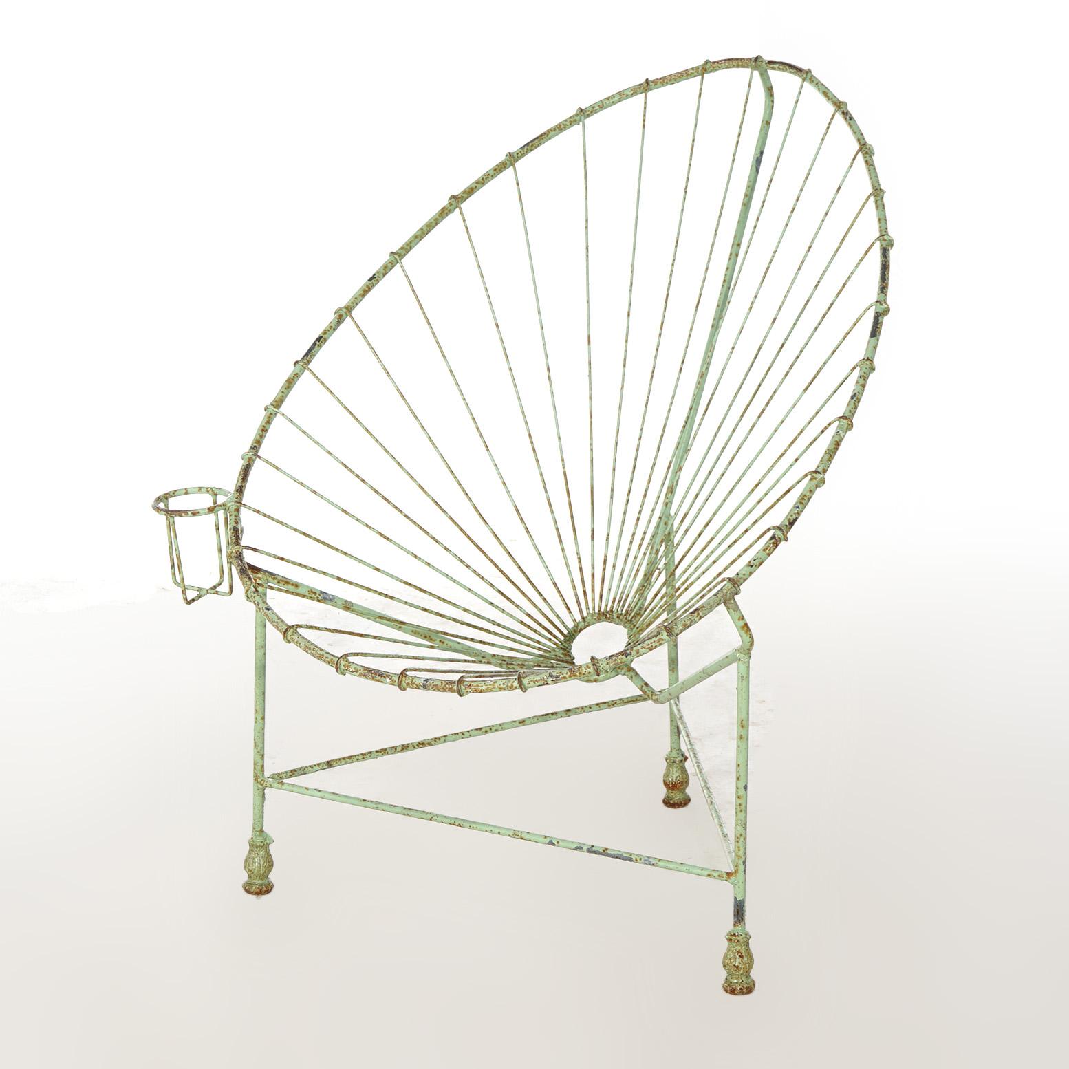 A Mid Century Modern egg garden chair offers painted wire construction with beverage holder, 20th century

Measures - 36
