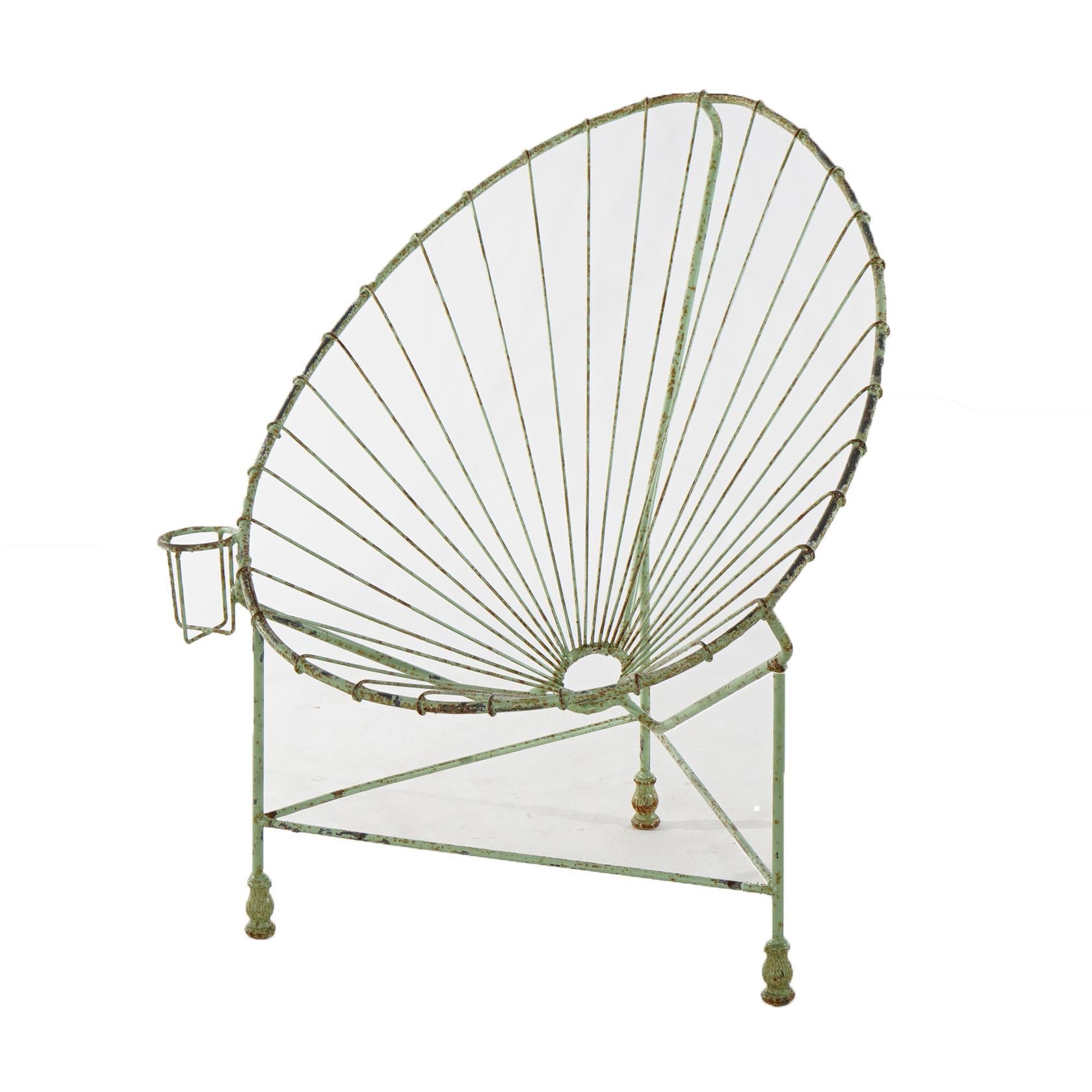 A Mid Century Modern egg garden chair offers painted wire construction with beverage holder, 20th century

Measures - 36