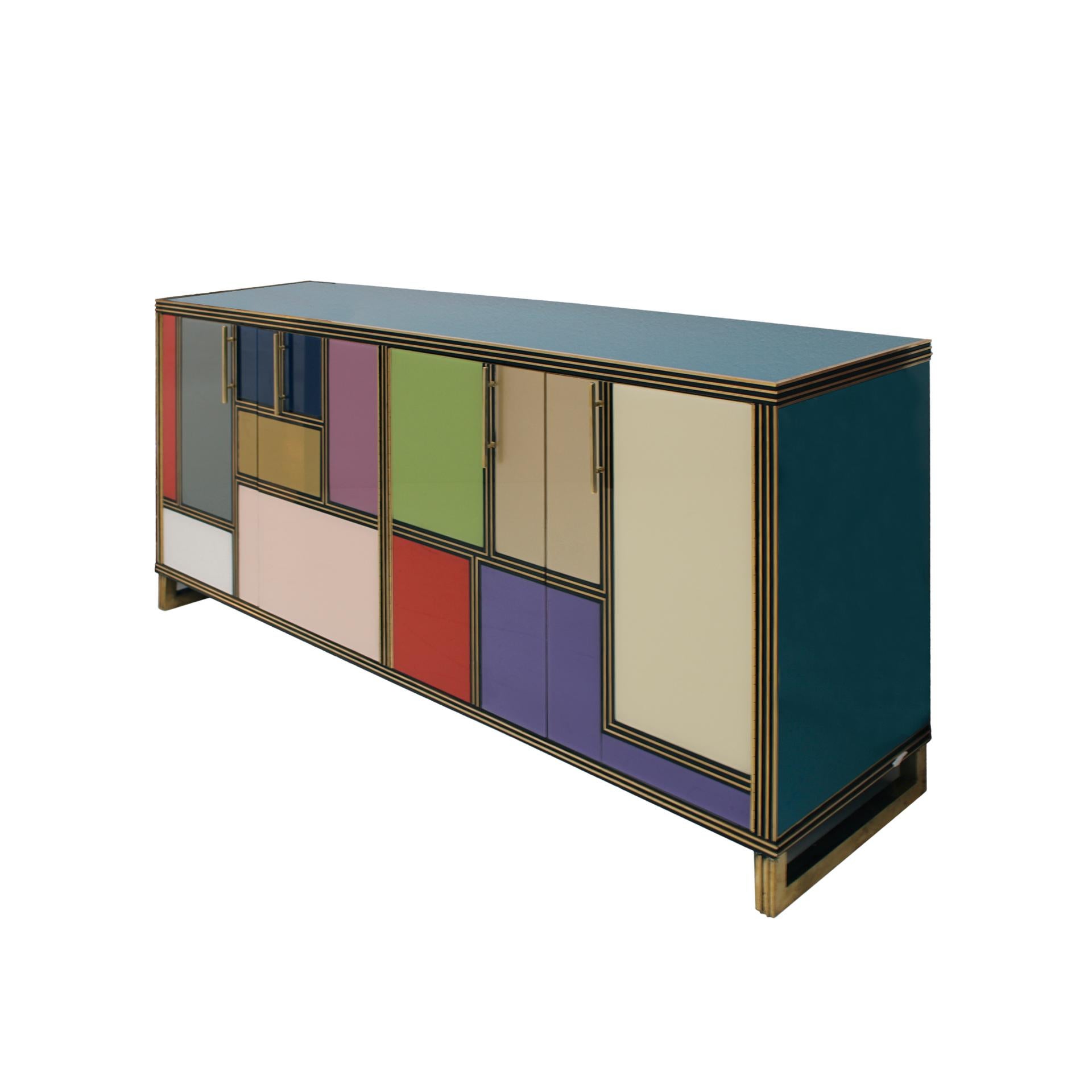 Italian sideboard composed of four folding doors and one shelf inside. Original wood structure from the 50´s covered in colored glass and brass profiles, handles and legs. Italian manufacture.

Production can last between 5 and 6 weeks.

Our main