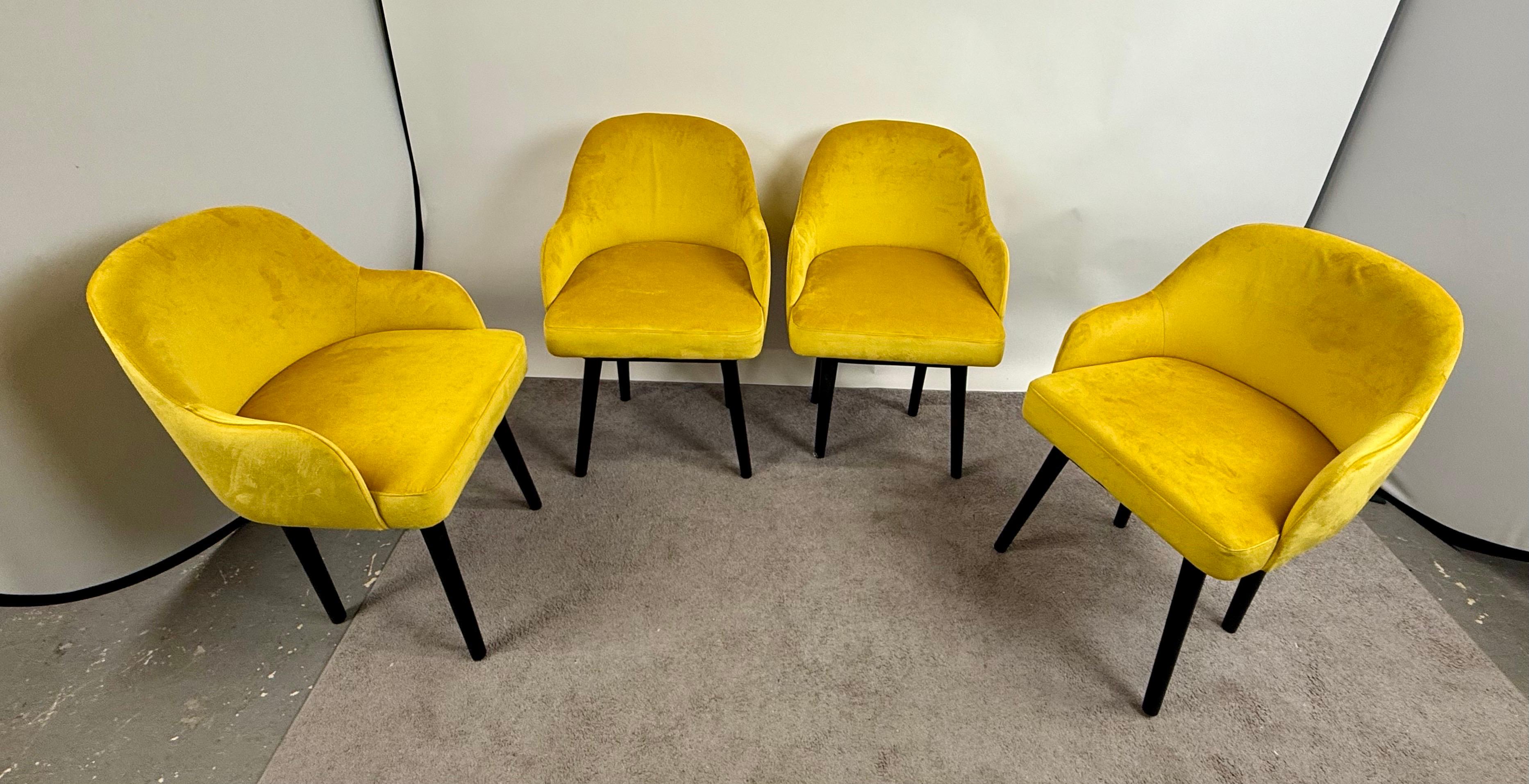 
Mid Century Modern Style Yellow Velvet  & Ebony Dining or Side Chair, Set of 4: 

This exquisite set of four Mid-Century Modern dining or side chairs exudes a refined elegance, seamlessly blending timeless design with a bold contemporary flair.