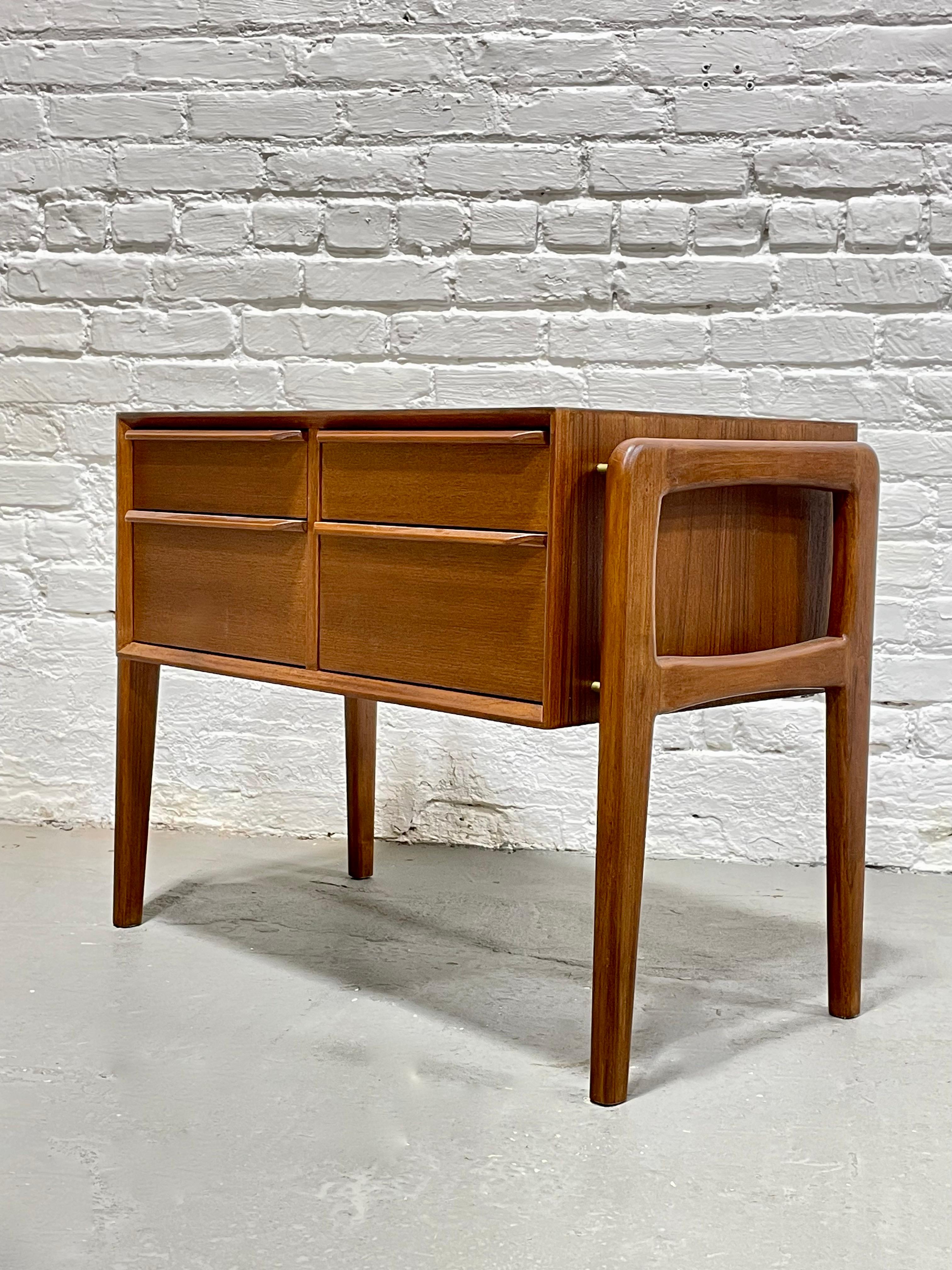 Perfect Mid-Century Modern styled cabinet, perfect as an entryway cabinet, bedside cabinet or storage cabinet. Loads of design details including sculpted hand pulls, brass hardware supporting 