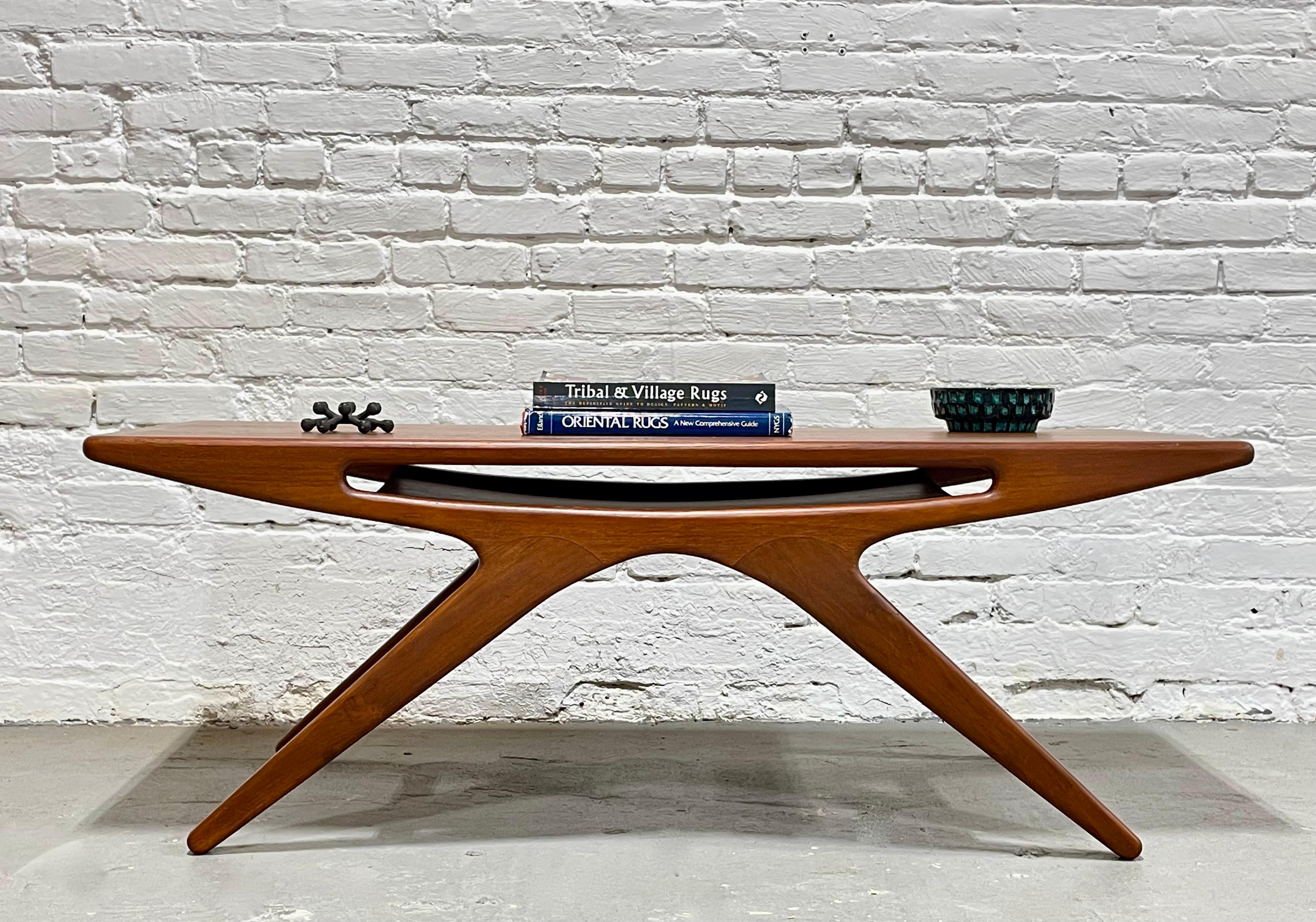 Phenomenal Mid-Century Modern styled Handmade Teak Coffee Table featuring unbelievable lines and gorgeous design. Interior compartment allows for magazine or book storage. Super high quality workmanship, handmade from reclaimed teak.