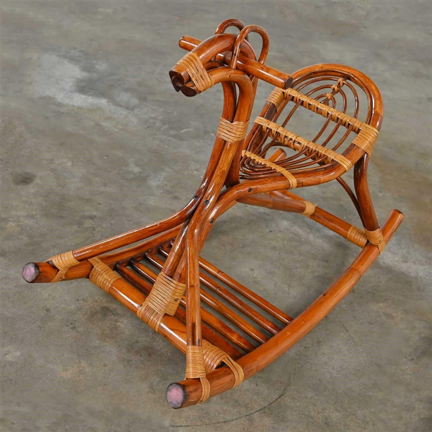 Wonderful Mid-Century Modern stylized rattan rocking horse in lovely condition, keeping in mind that this is vintage so will show signs of wear and use. There are no noticeable flaws that we have detected. Please see photos and zoom in for details.