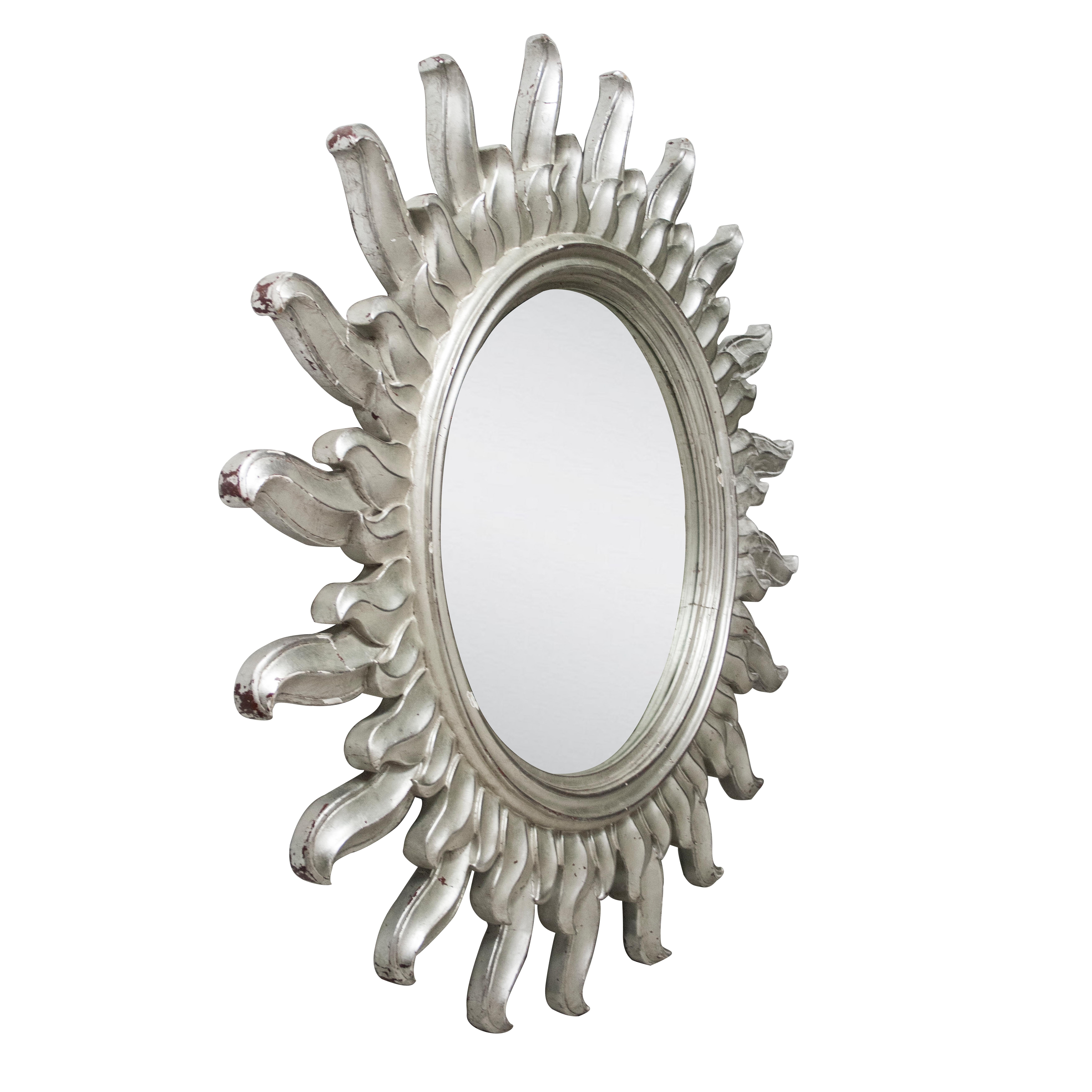 French sun form mirror, carved by polychrome hand finished in a silver bath.
 