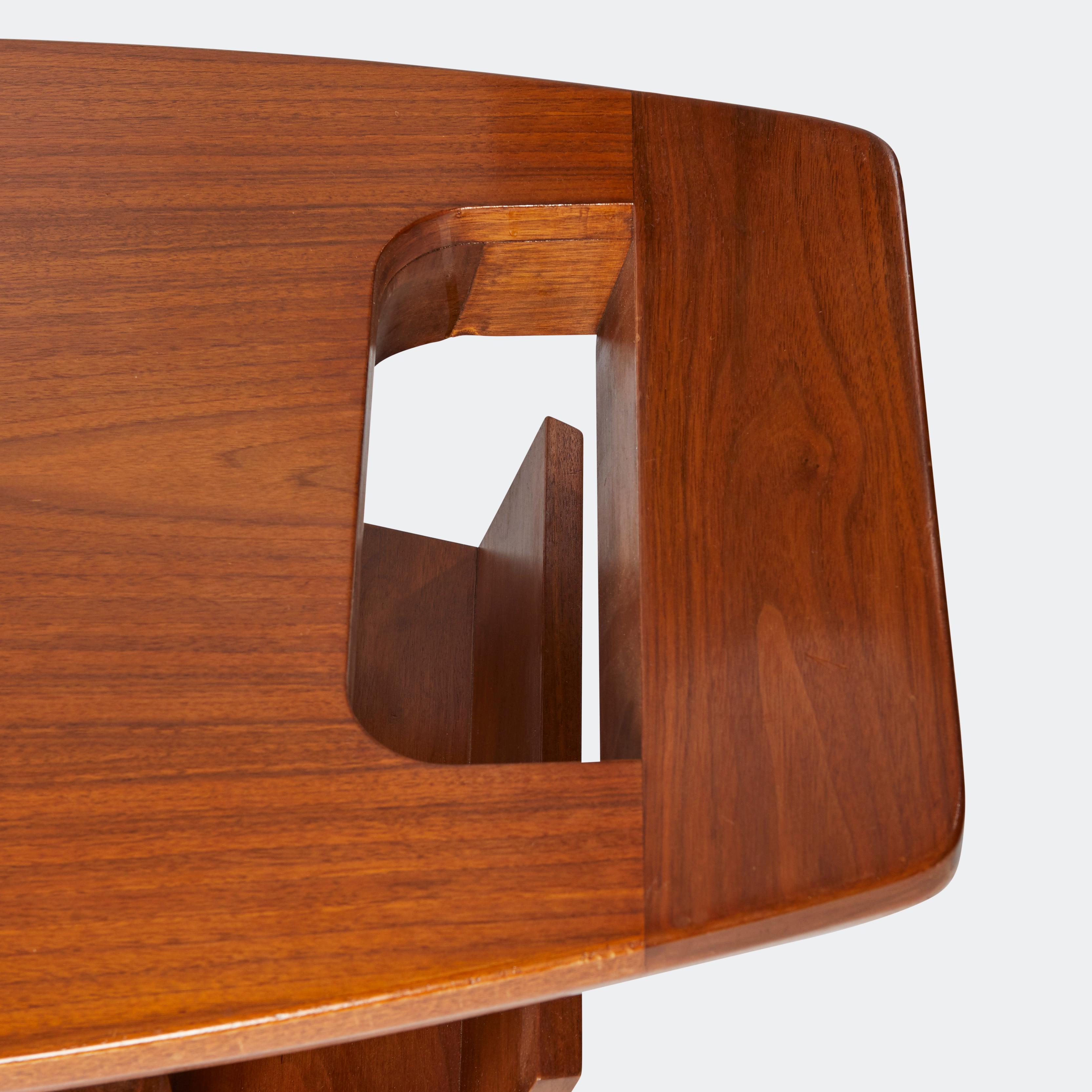 A teak surfboard coffee table, attributed to T.H. Robsjohn-Gibbings. Mid-century modern floating top design with tapered legs, copper stretchers, a handle detail, and an angled side rack. Provenance an interior designed for Arturo Peralta-Ramos, son