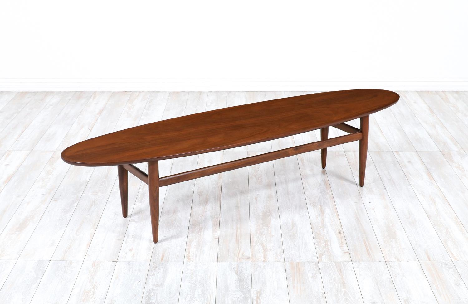 Mid-Century Modern Surfboard Style coffee table by Henredon.

________________________________________

Transforming a piece of Mid-Century Modern furniture is like bringing history back to life, and we take this journey with passion and precision.