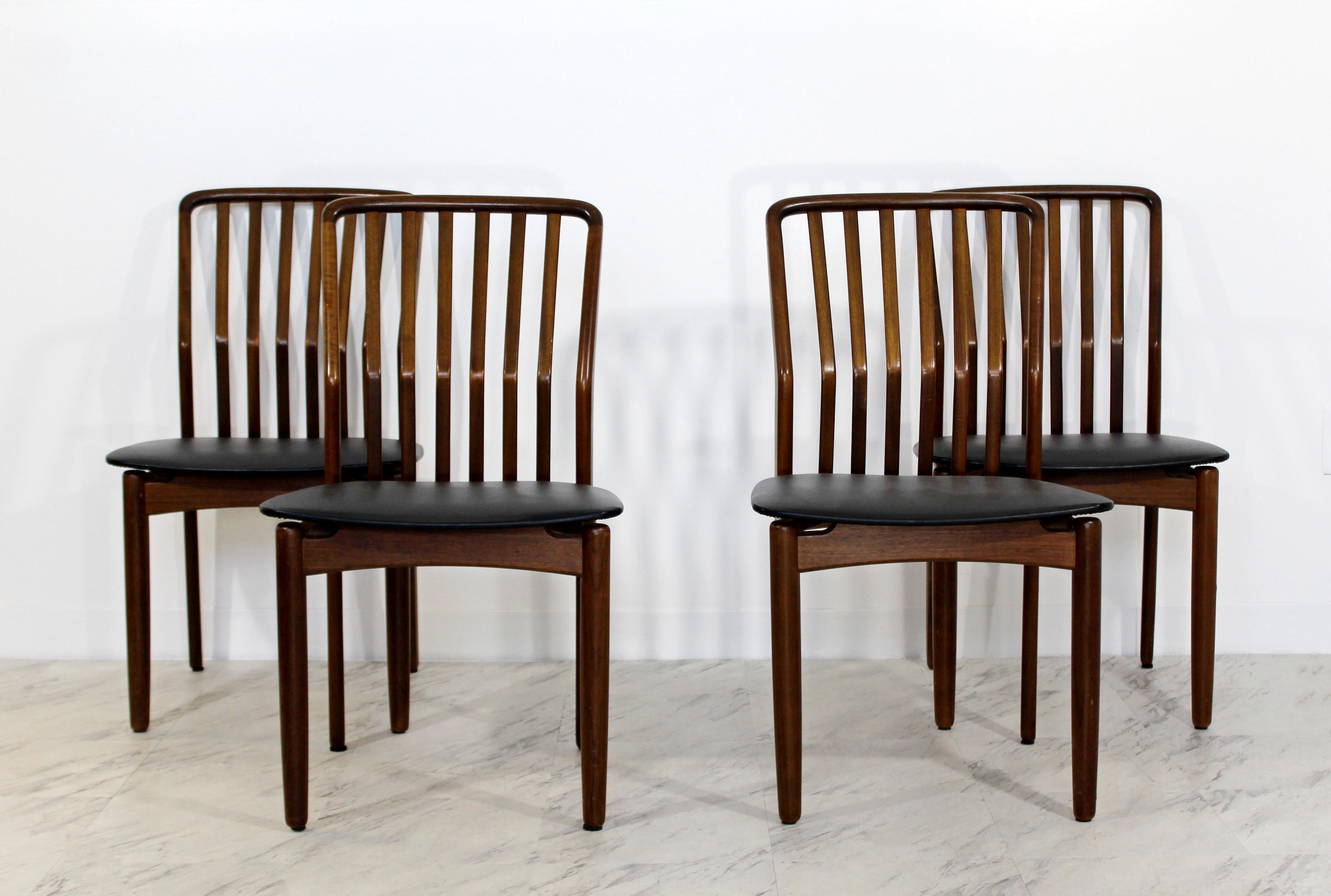For your consideration is a marvellous set of four, walnut and black leather, side dining chairs, by Sven Madsen, circa 1950s. In very good condition. The dimensions of each chair are 19