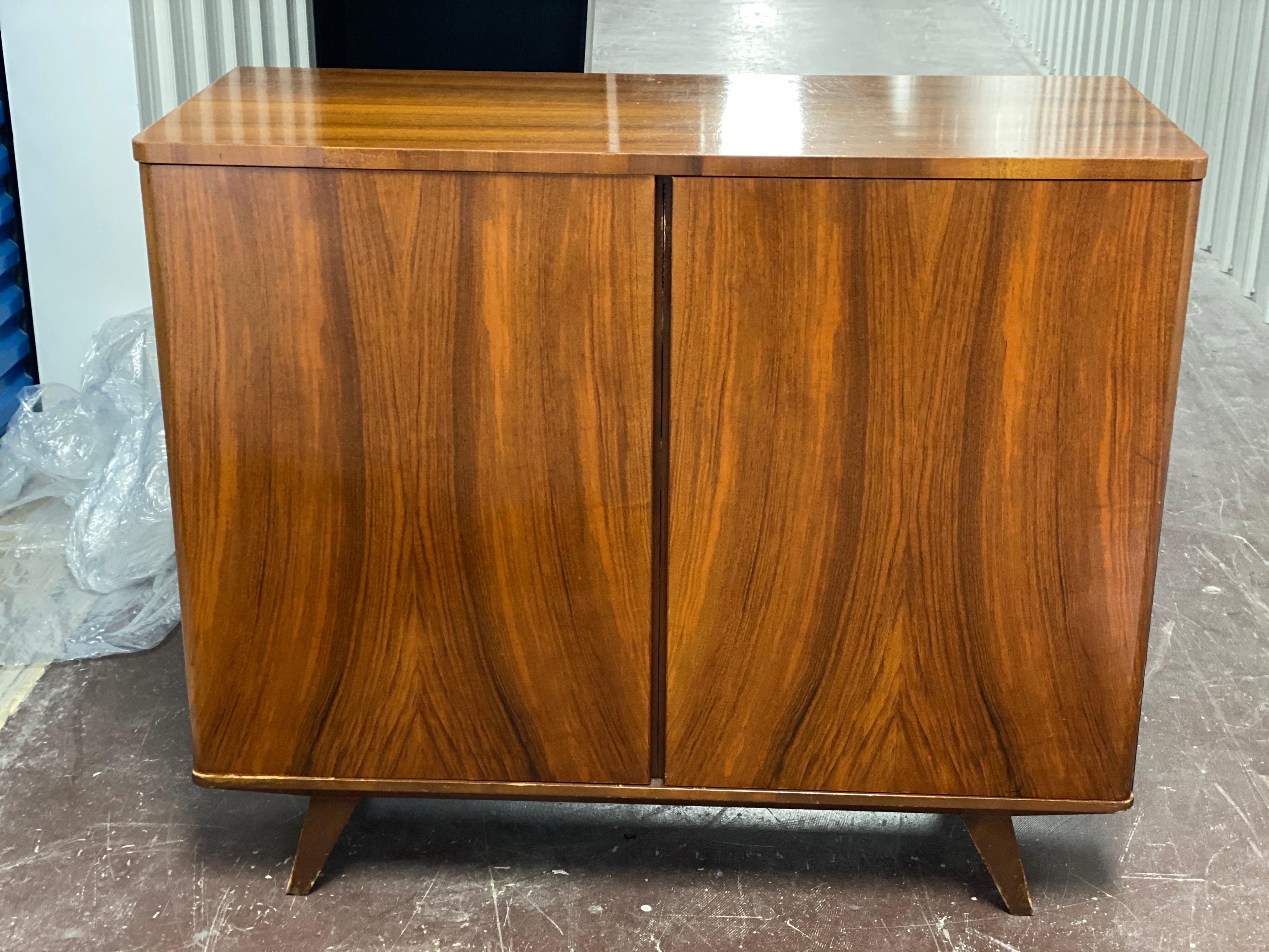 Mid-Century Modern Swedish cabinet
Beautifully designed rectangular piece with rounded edges. Two doors open to a beech wood interior of drawers and shelves. Doors are cleverly designed with place to grip doors open without the need for hardware.