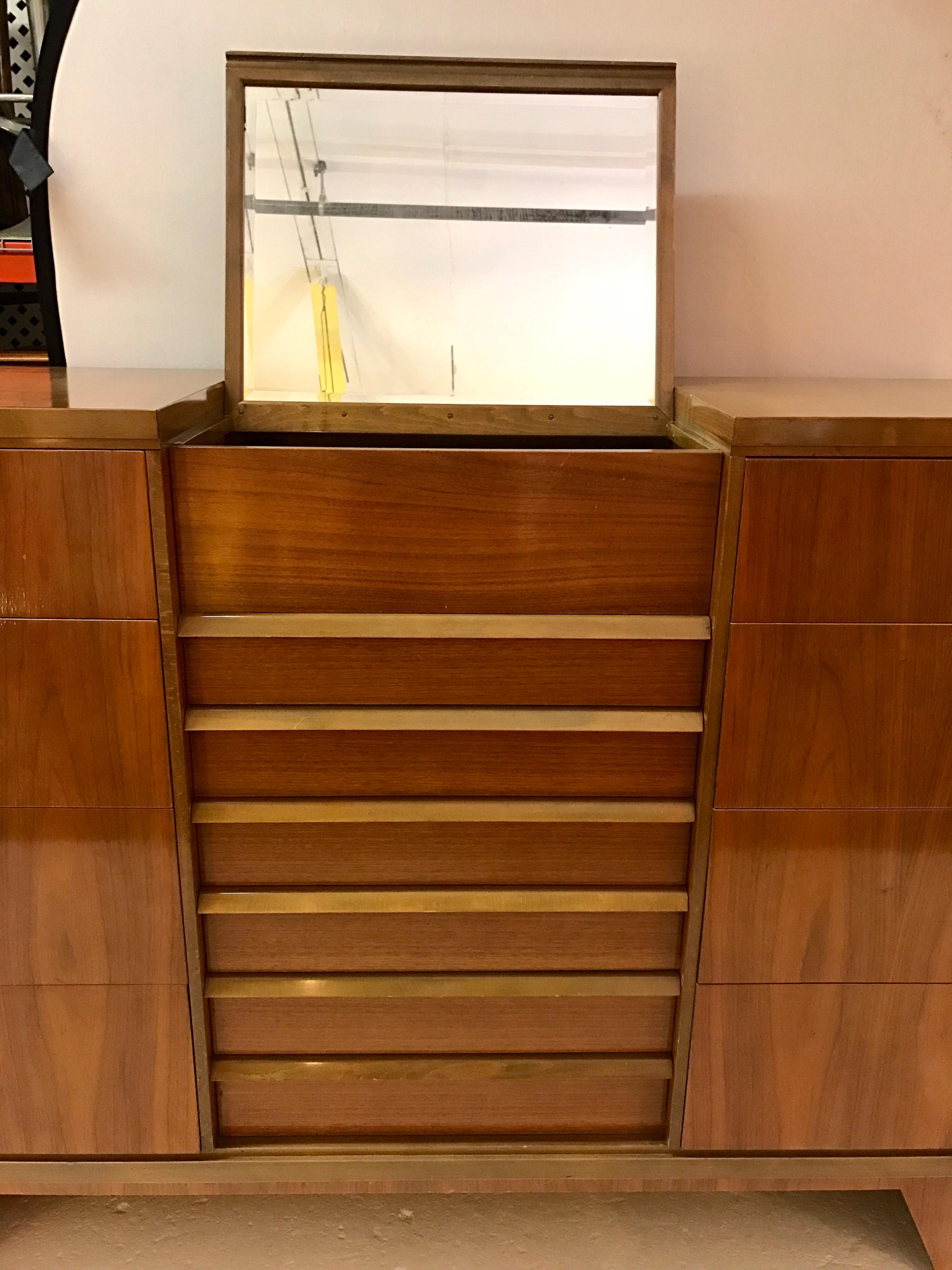 Mid-Century Modern vanity dresser with sliding mirror at top. It has 14 drawers and a sliding pop up mirror at top.