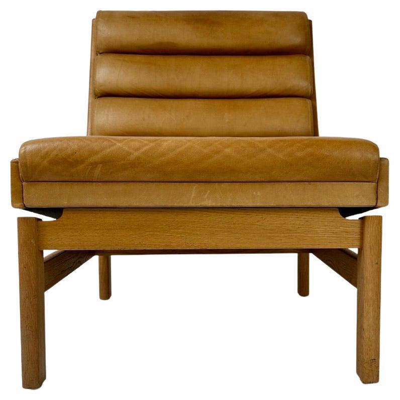 Mid-Century Modern Swedish Oak & Cognac Leather Lounge Chair by K. E. Ekselius For Sale