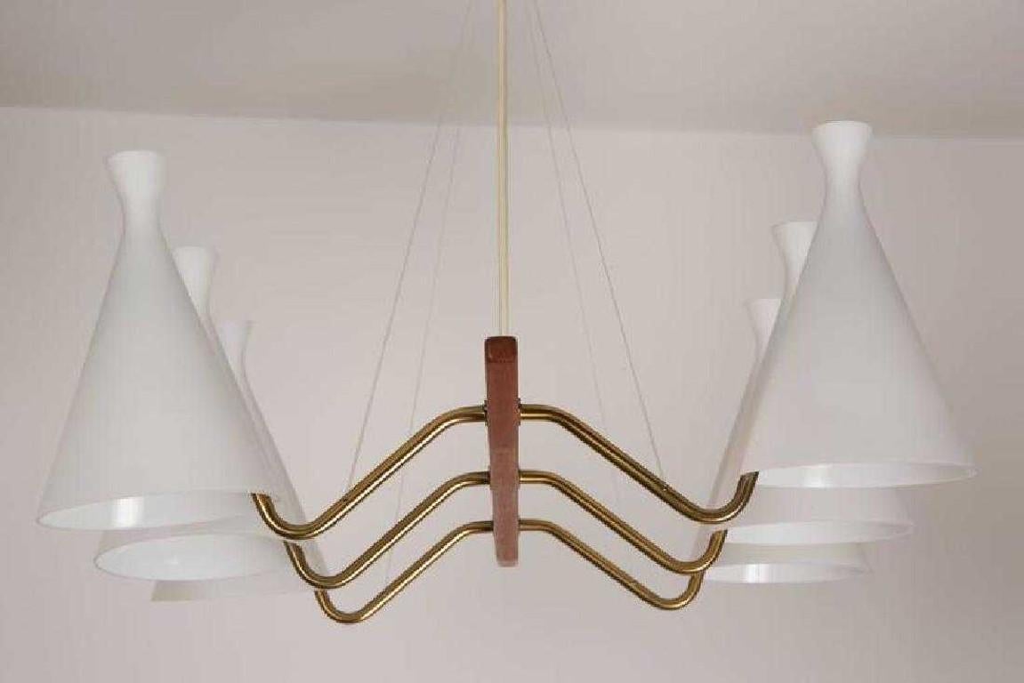 Mid-Century Modern teak and white satin glass six-arm chandelier, Sweden, 1950s.

Measures: 23 H x30 W x31 D inches.