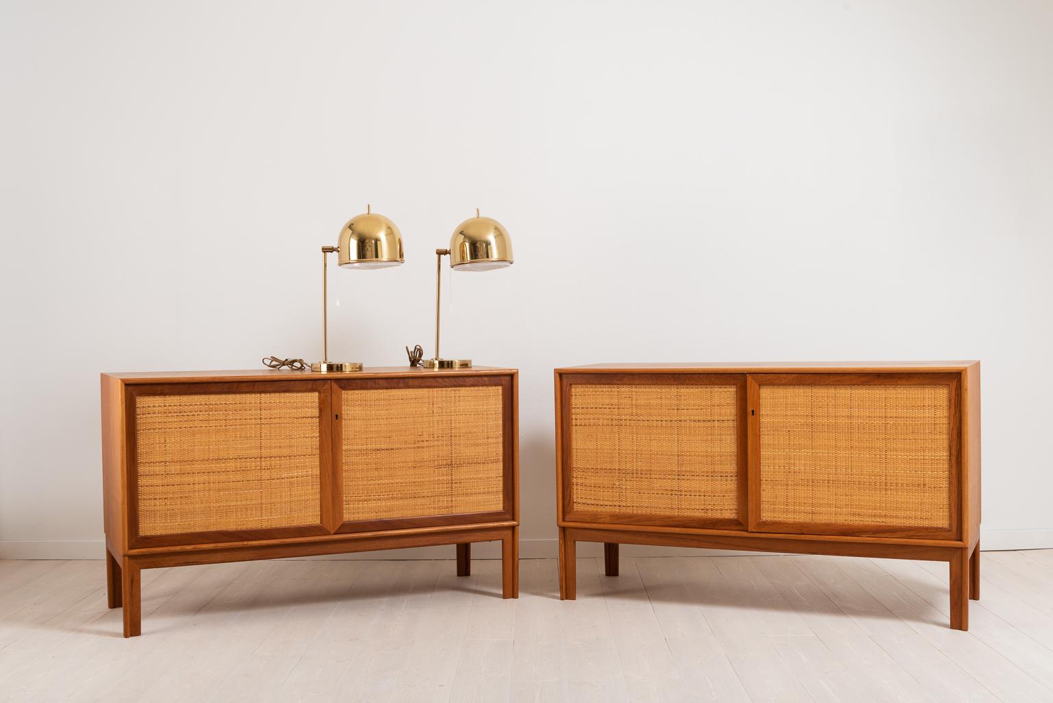 Pair of sideboards by Alf Svensson for Bjästa Snickerifabrik. The sideboards are made in teak and the doors dressed in rattan. Designed and manufactured circa 1960s.