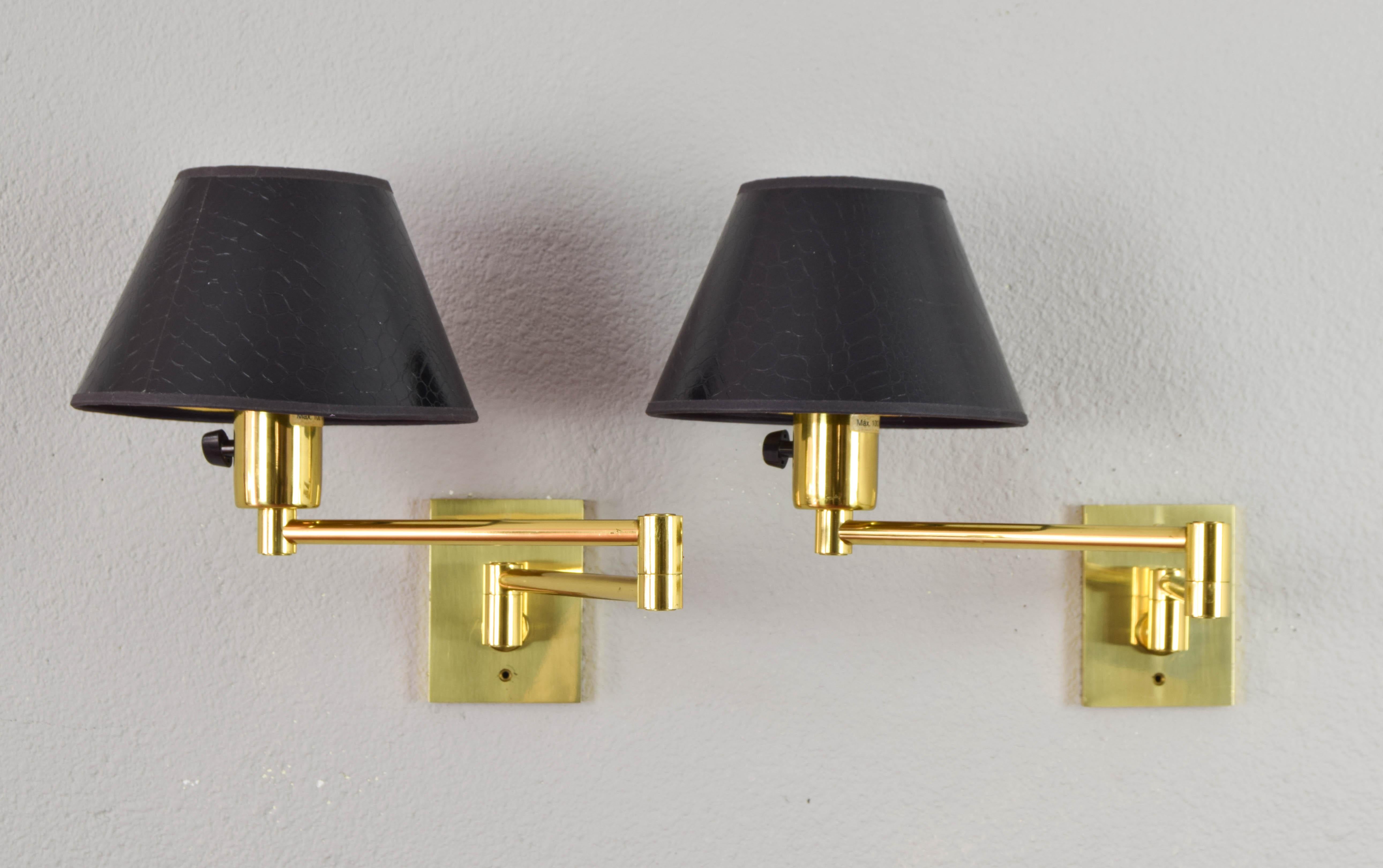 Pair of wall lamps designed by George W. Hansen in the 1960s and produced by the Spanish firm Metalarte with permission from Hansen Lamps New York in the 1970s. Brass structure and articulated arm.

Measurements:
Depth 54 cm
Length of each arm