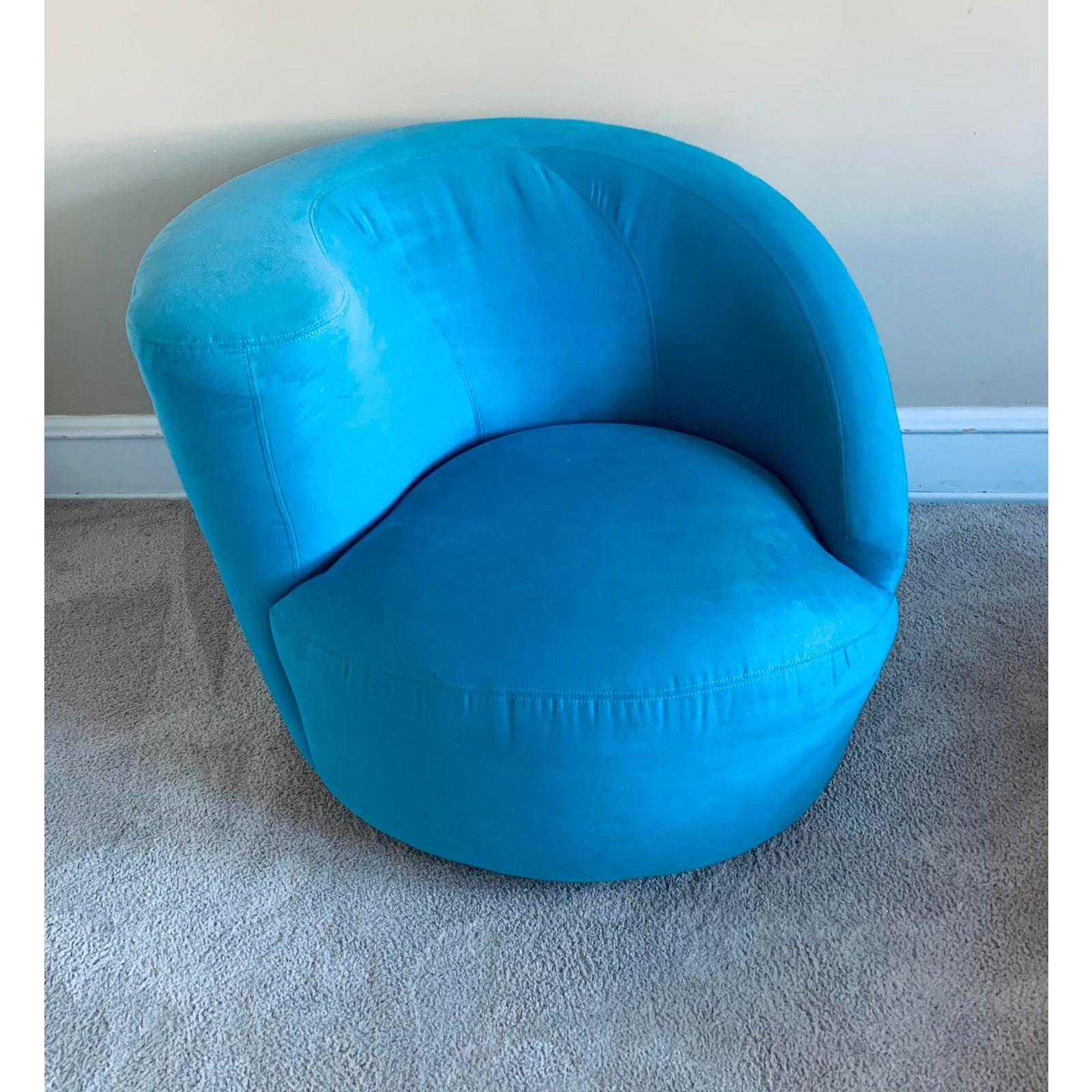 A beautiful Nautilus chair in turquoise-blue ultrasuede.

Directional tags attached.

Currently upholstered in a turquoise blue- think Miami Vice.

