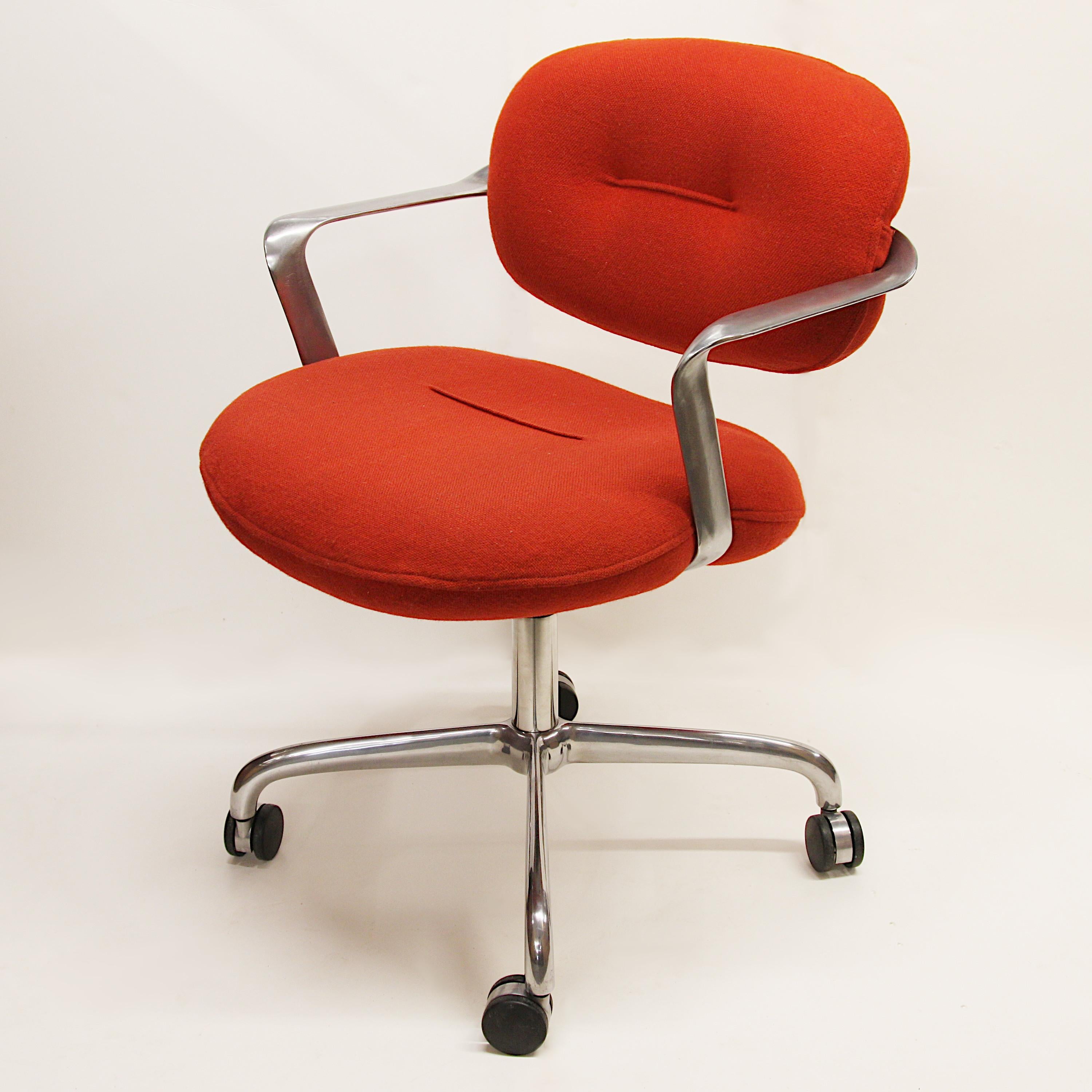 Arguably one of the most elegant desk chair designs from the mid-century era, this Morrison/Hannah design for Knoll Studios is utilitarian sculpture at its best. Chair features a curvaceous, cast-aluminum frame, red/orange tufted cushions, and