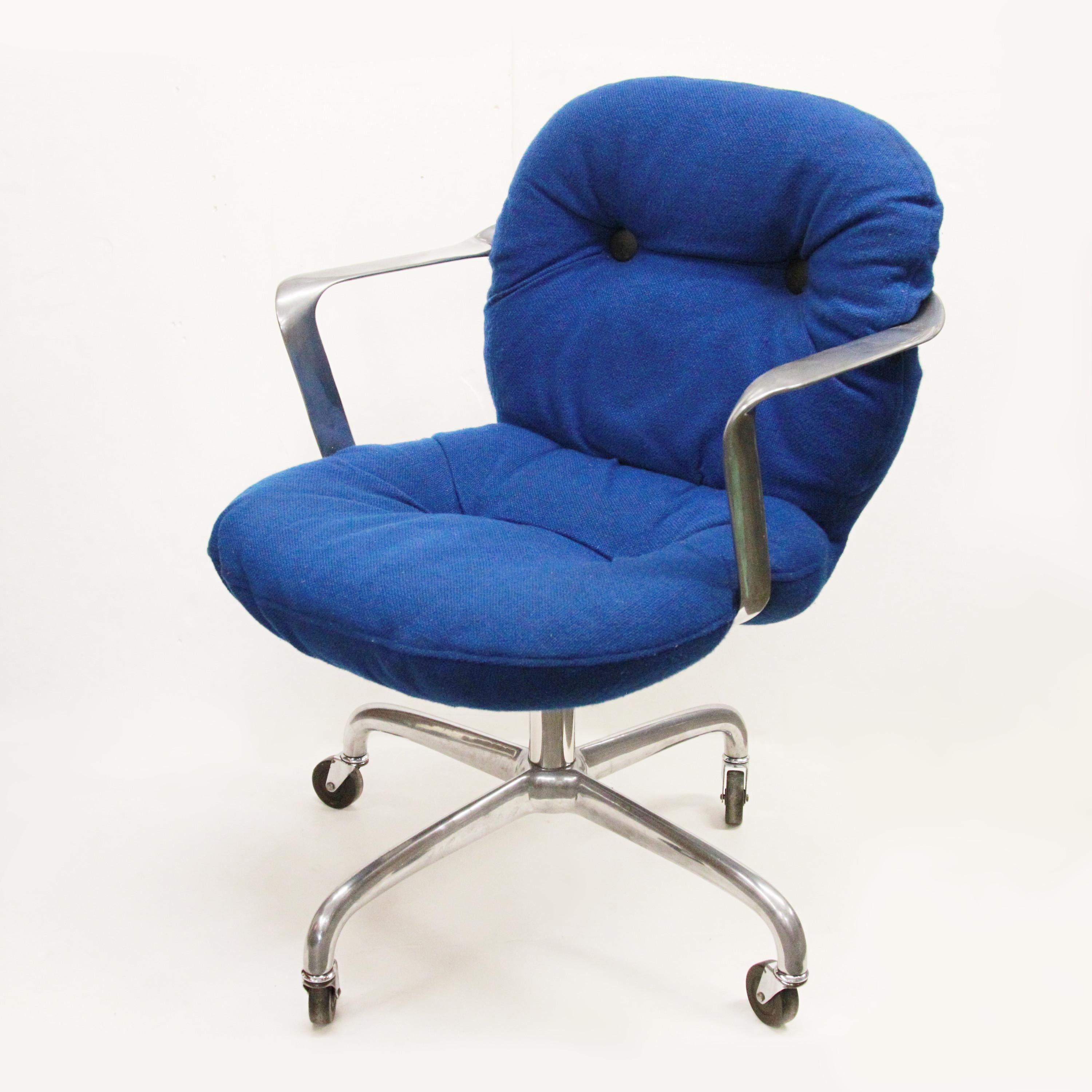 Arguably one of the most elegant desk chair designs from the mid-century era, this Morrison/Hannah design for Knoll Studios is utilitarian sculpture at its best. Chair features a curvaceous, cast-aluminum frame, blue tufted cushions, and aluminum