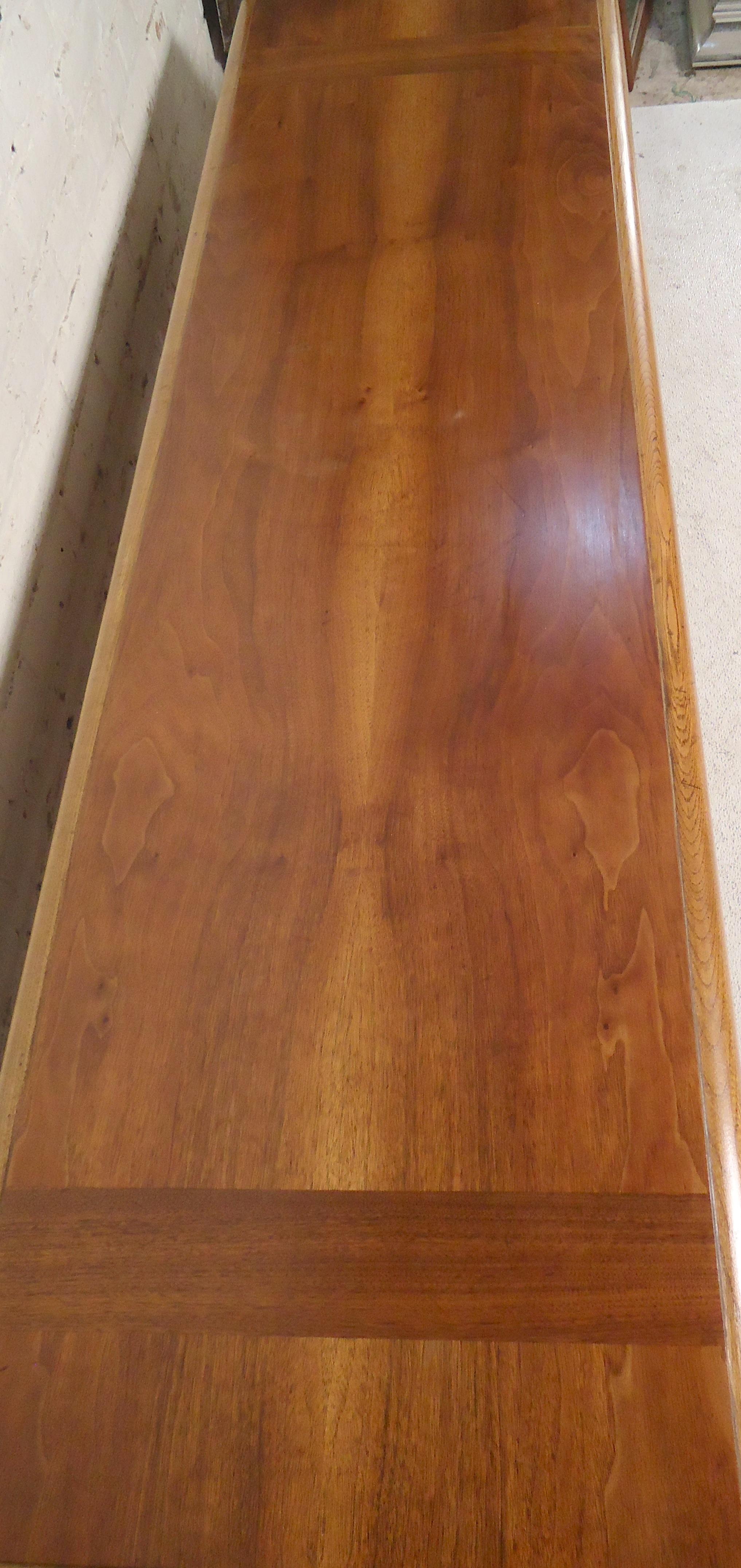 Walnut coffee table with bottom shelf. Warm walnut grain with oak base.

(Please confirm item location - NY or NJ - with dealer).
 
