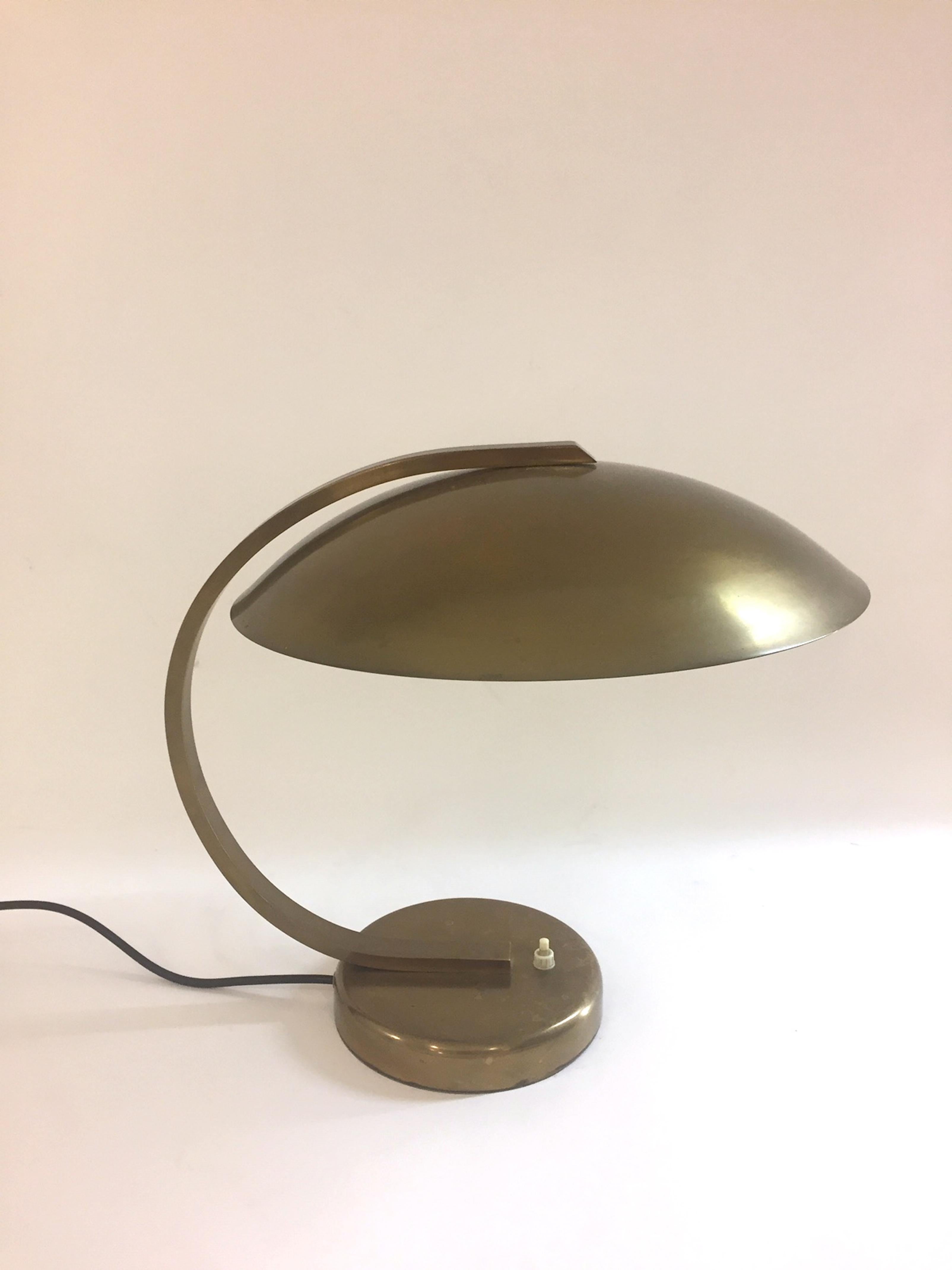 A German Bauhaus style table lamp. Brass frame. Good vintage condition.