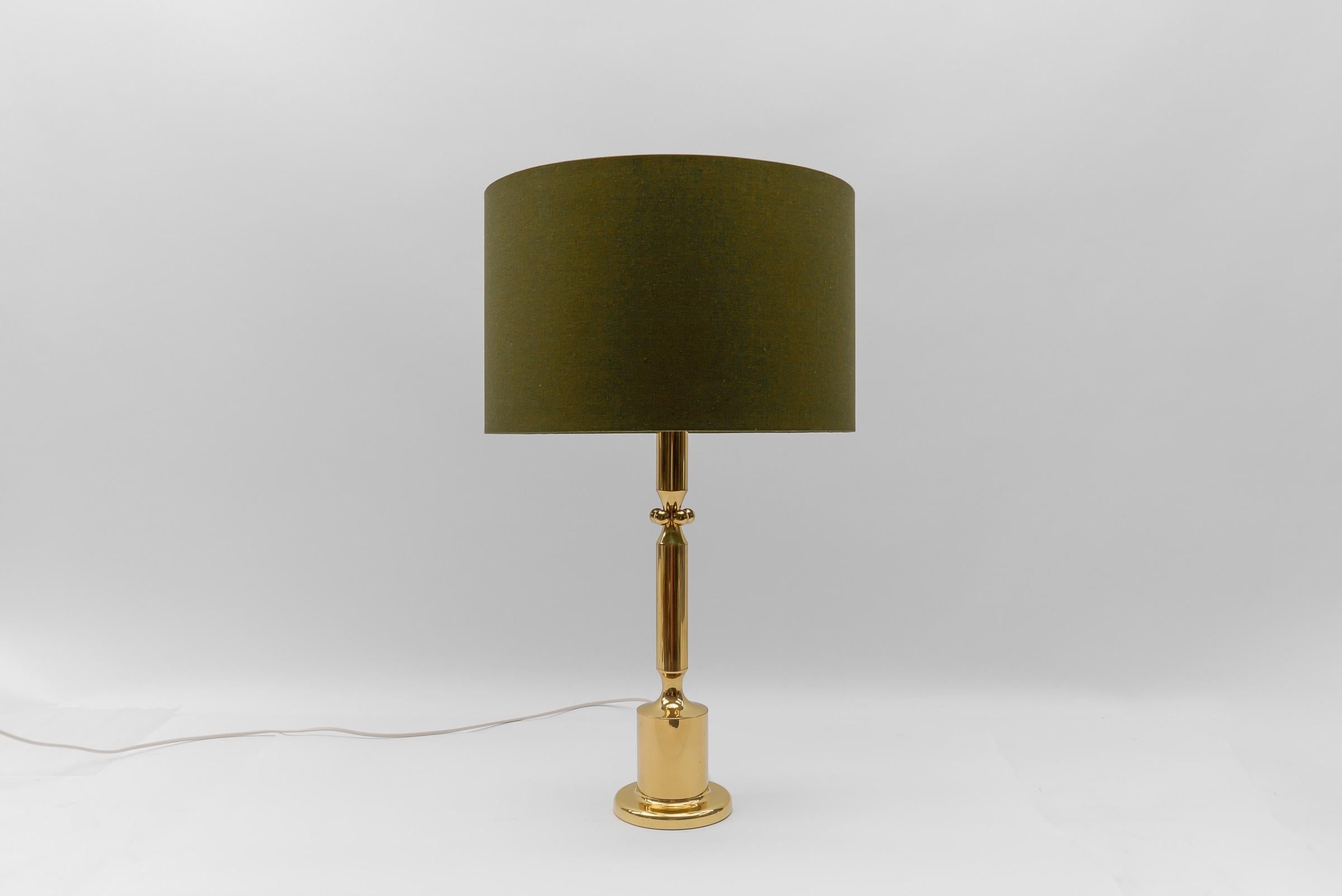 Mid Century Modern Gold Table Lamp Base, 1960s Germany

The lampshade is to illustrate how the lamp base looks with a shade. The shade has a diameter of 17.71 in. (45 cm) and height 11.41 in. (29 cm).

One E27 socket. Works with 220V and 110V.

Our