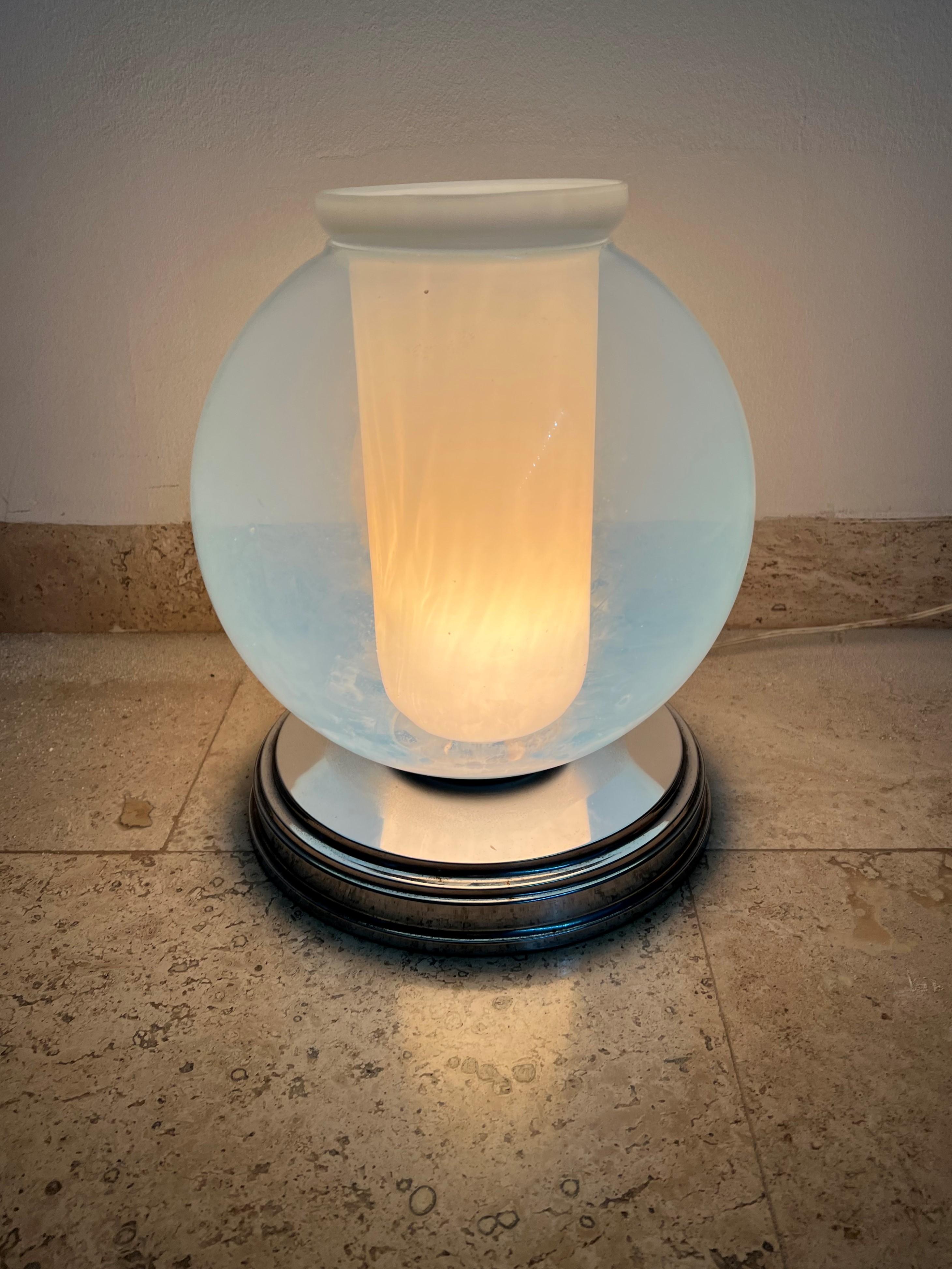 Space age one-light table lamp by Carlo Nason for Mazzega, circa 1970.
This lamp consists of 2 separate pieces in white and opalescent blue Murano glass.
 