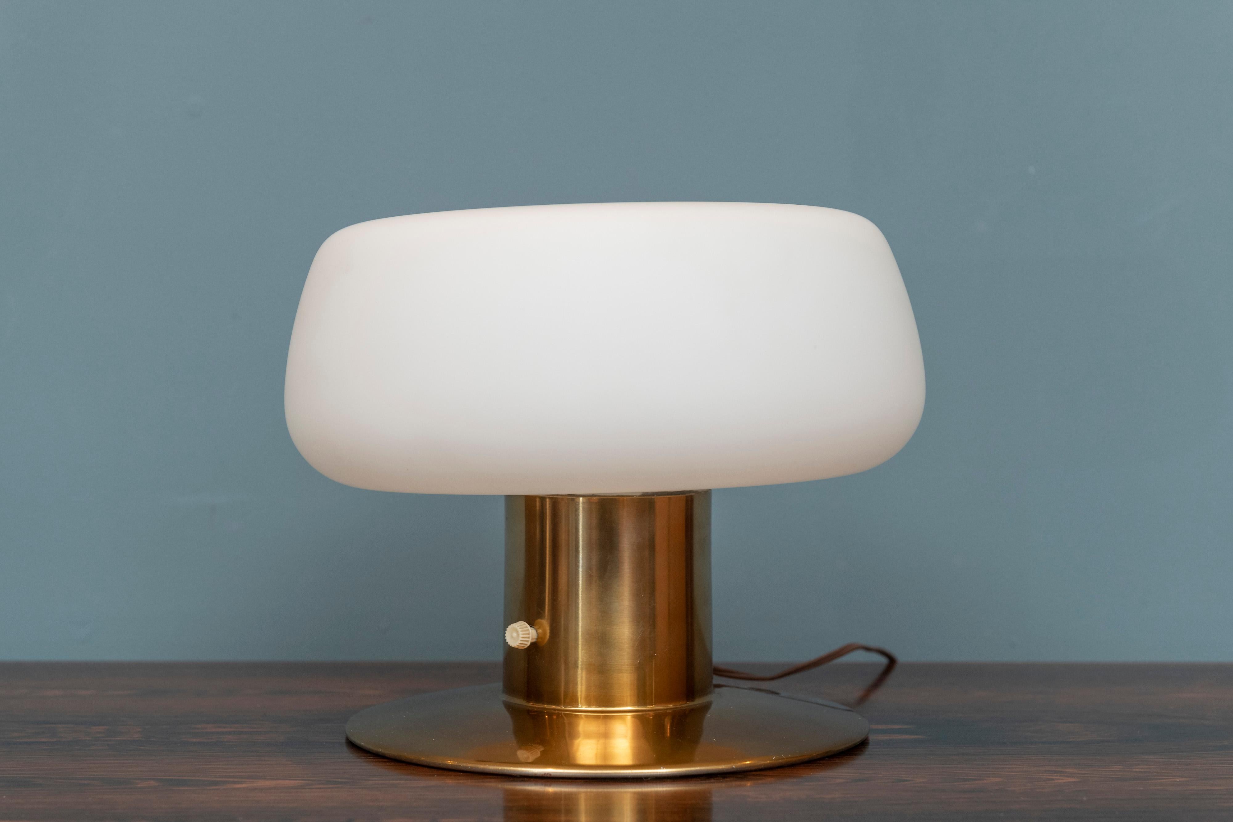 Mid-Century Modern mushroom table lamp by Laurel Lamp company. Rare model with a brass base and dimpled mushroom glass shade in good working condition.
New old stock example never used retains original factory tag and labels.