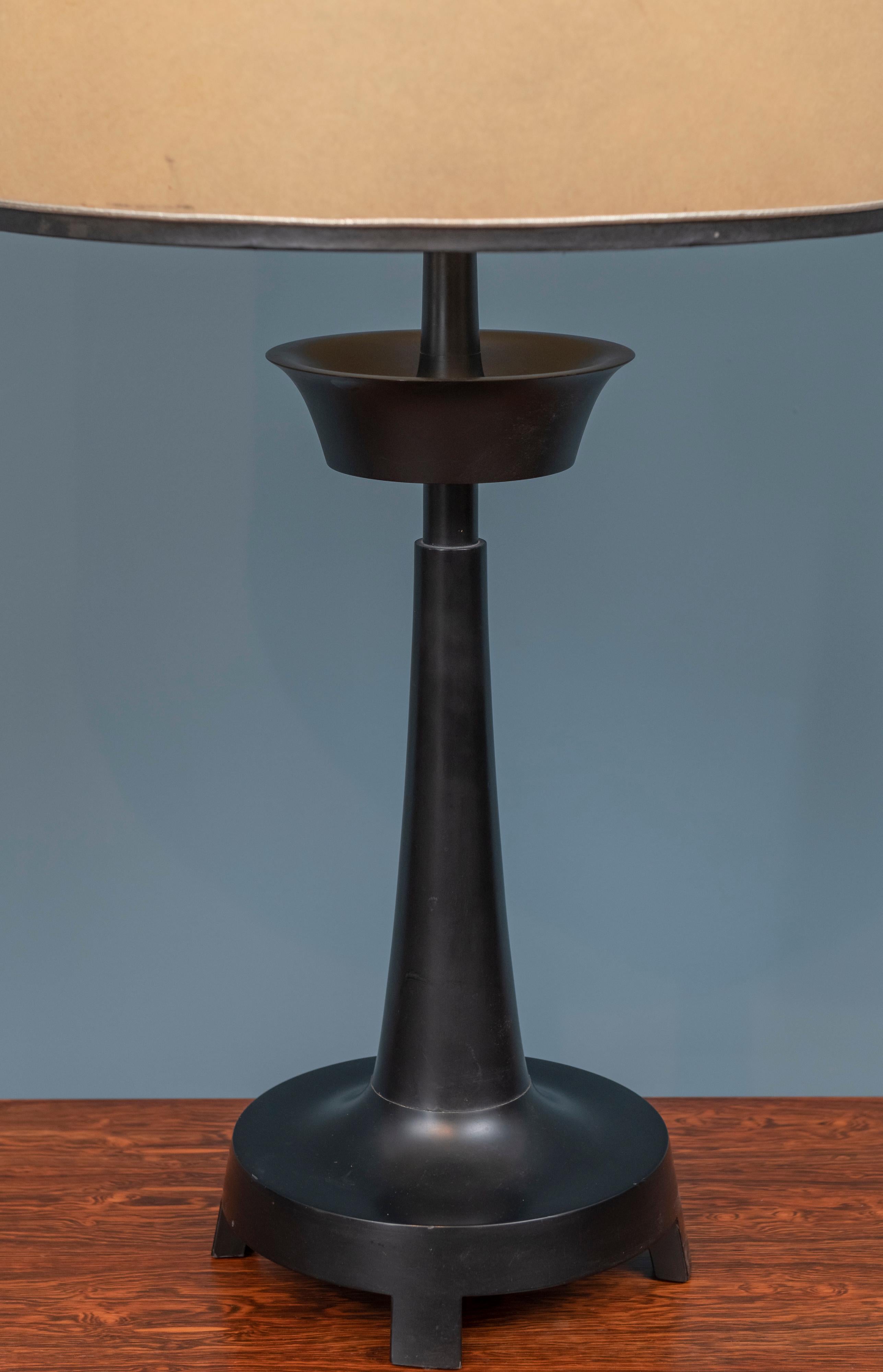 Mid-Century Modern monumental black lacquer table lamp with its original parchment shade. Large scale turned wood table lamp with amazing matching finial! Encompassing the greatest elements of the 1950s-1960s with over the top elements of the 1950s