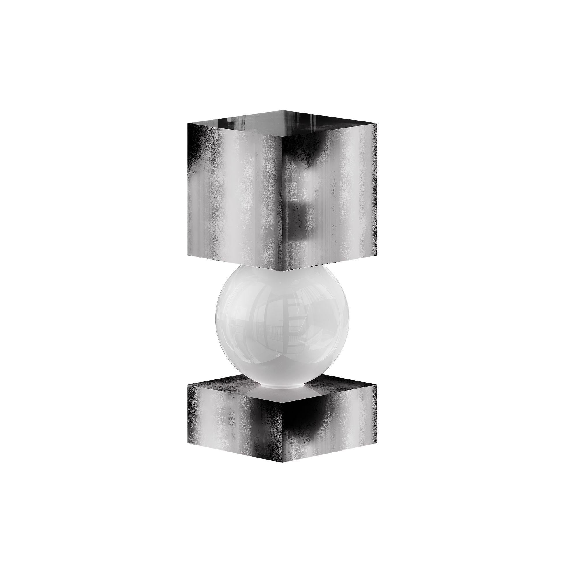 Mid-Century Modern Table Lamp, Geometric Shape Silver Leaf & Frosted Glass Light
The Athena Table Lamp Silver radiates sophisticated brilliance, combining geometric shapes with a hand-applied silver leaf finish. Its intersecting silhouette captures