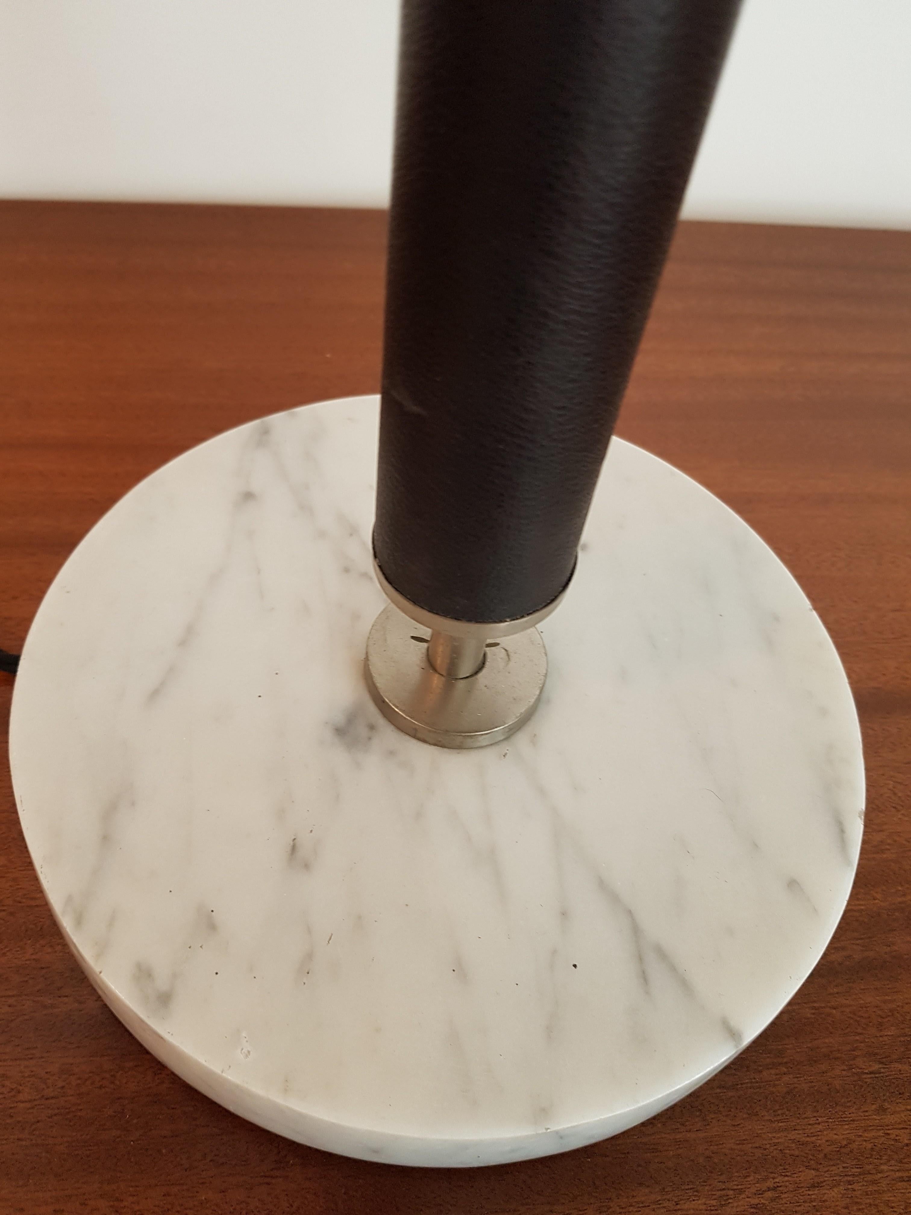 Well sized table lamp with thick Carrera marble base and leather clad stem. Comes complete with shade.