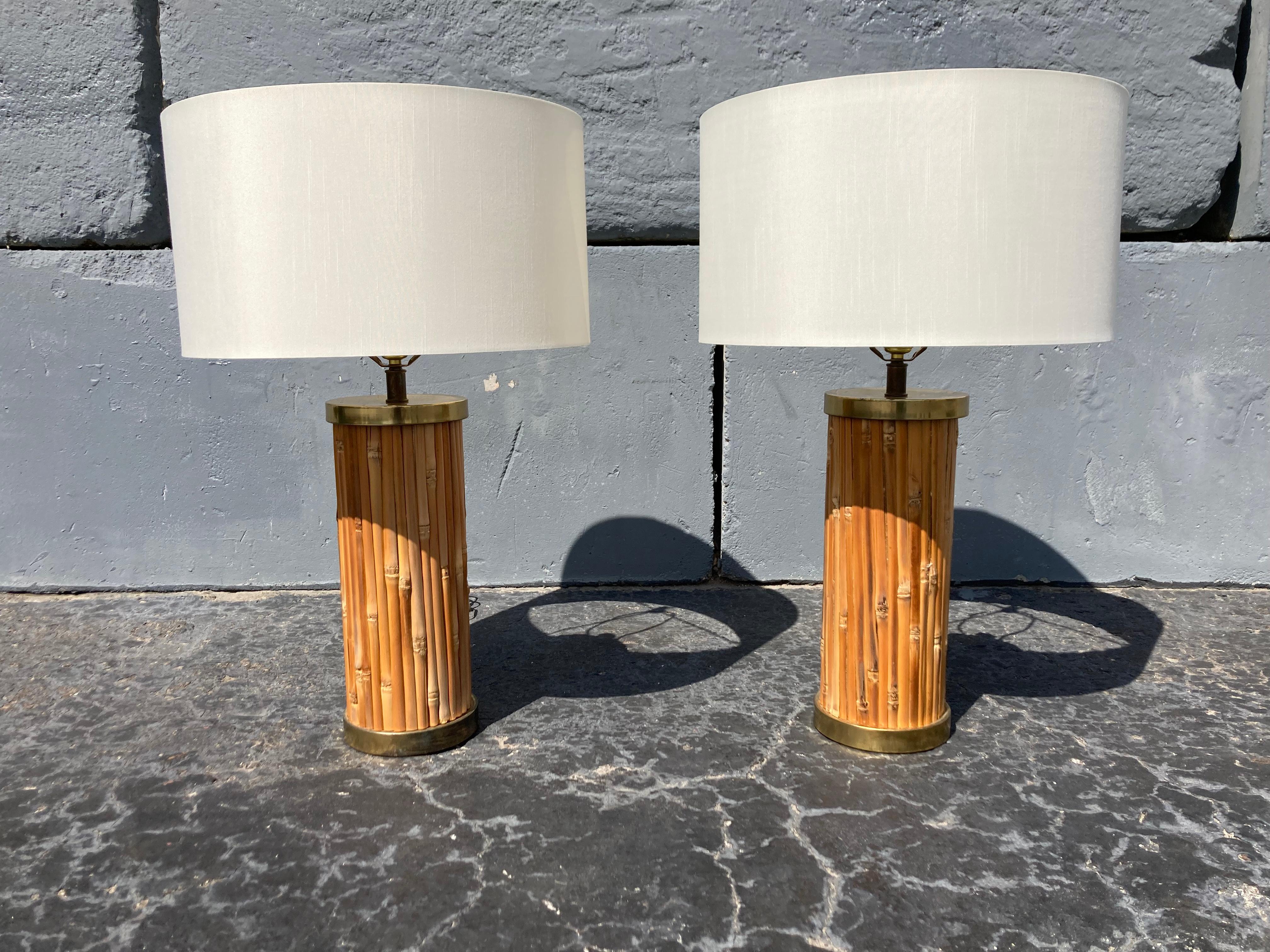 Pair of table lamps, brass plated metal and bamboo. Existing shades have some spots and will be replaced by seller.