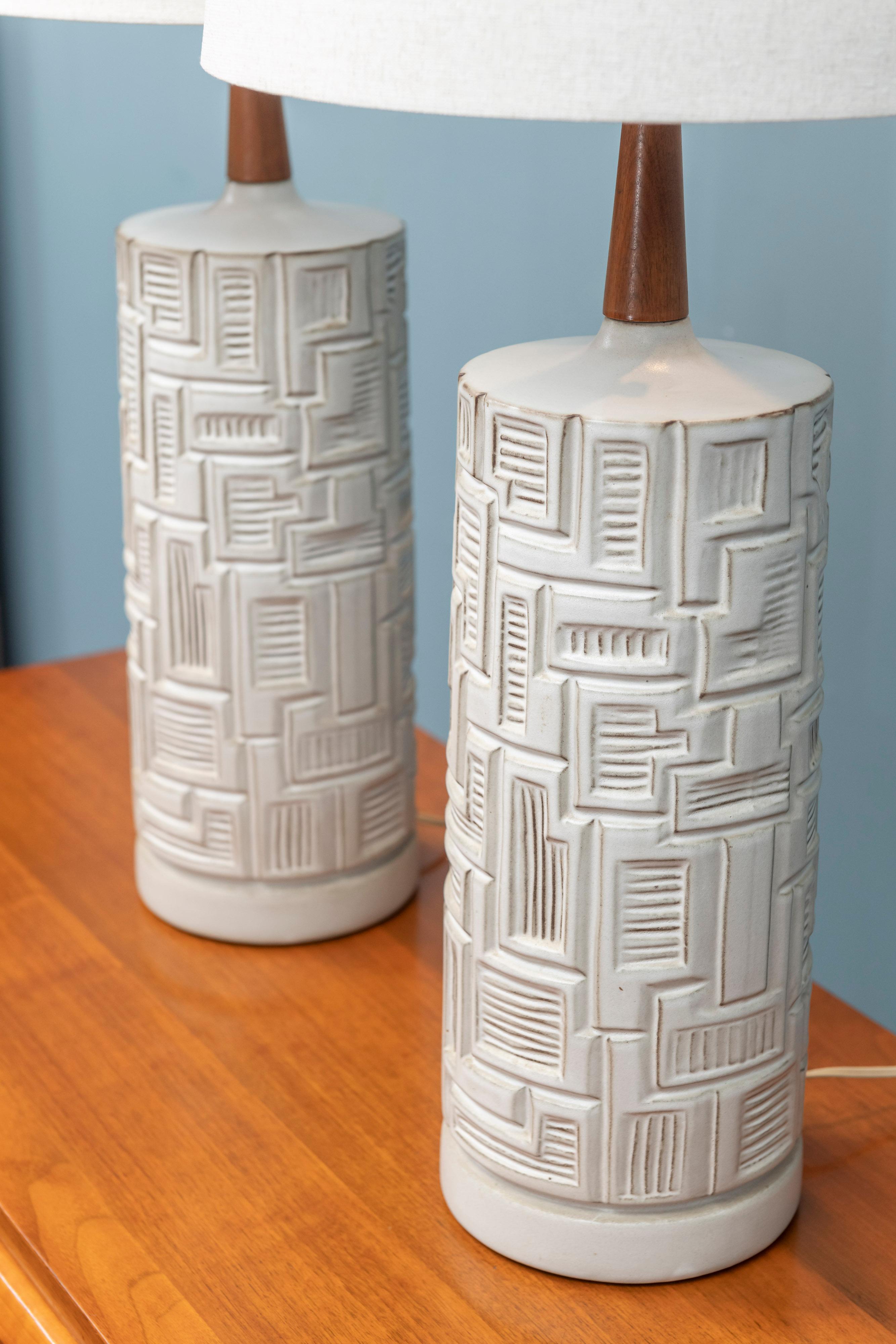 Pair of Mid-Century Modern ceramic table lamps, in very good original condition with new shades.