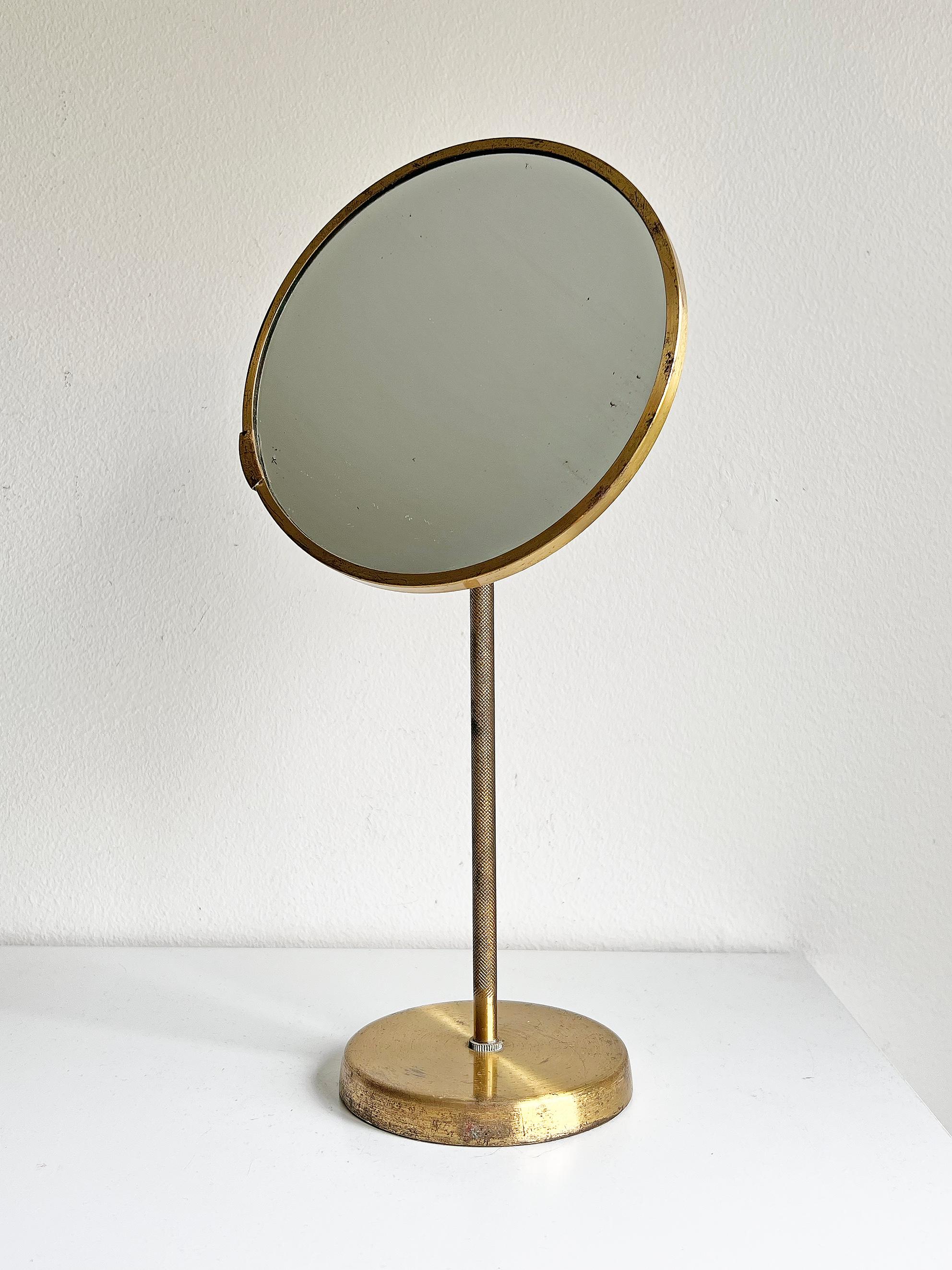 Swedish modern mirror in brass. Unknown designer and maker.
Good vintage condition, wear consistent with age and use. 
Age appropriate brass and mirror patina.
