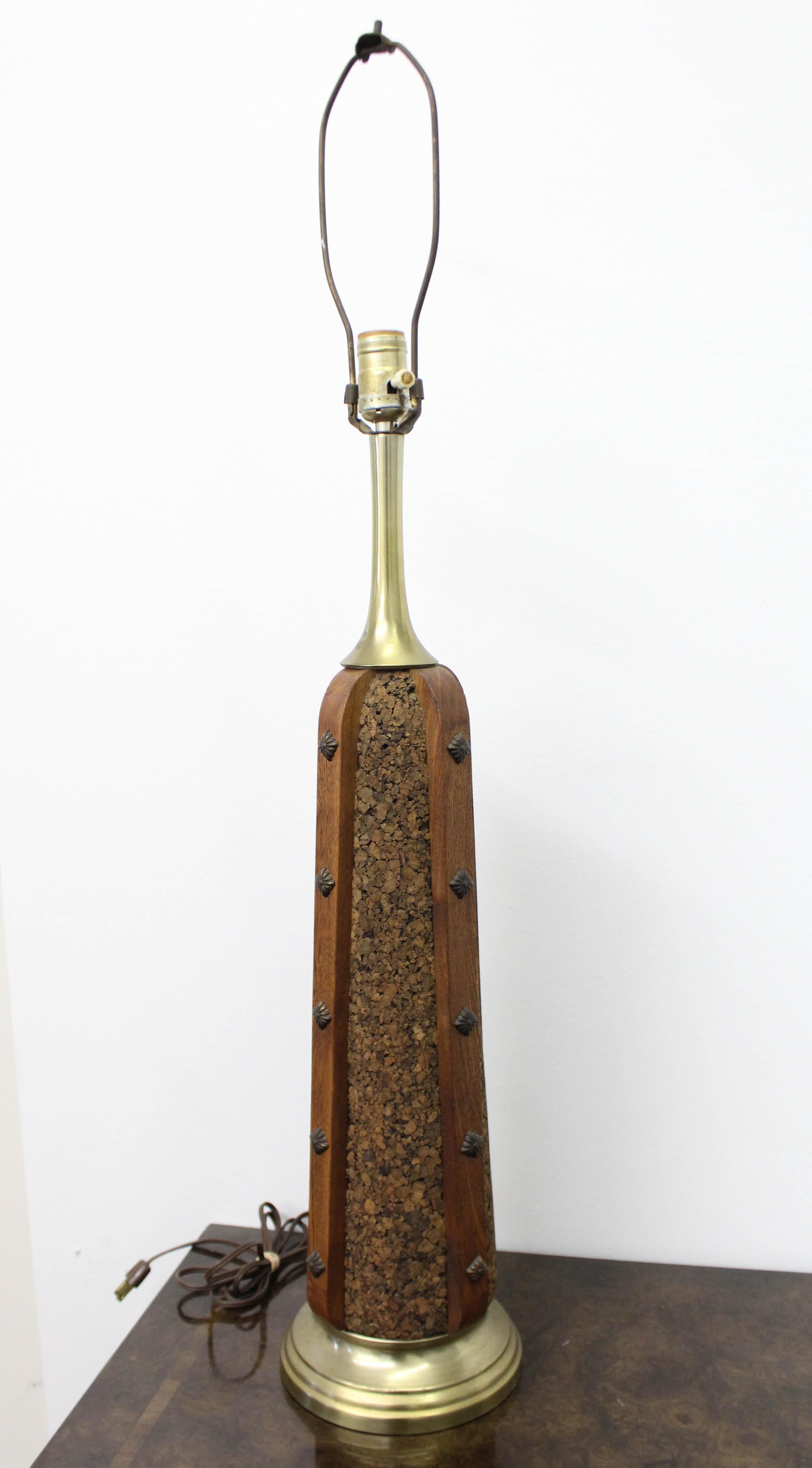 Offered is a funky vintage Mid-Century Modern lamp by Underwriters Laboratories. Has a funky base made of brass, cork, and wood trim with brass accents. It is in good, working condition given its age with some patina and age wear. Signed by