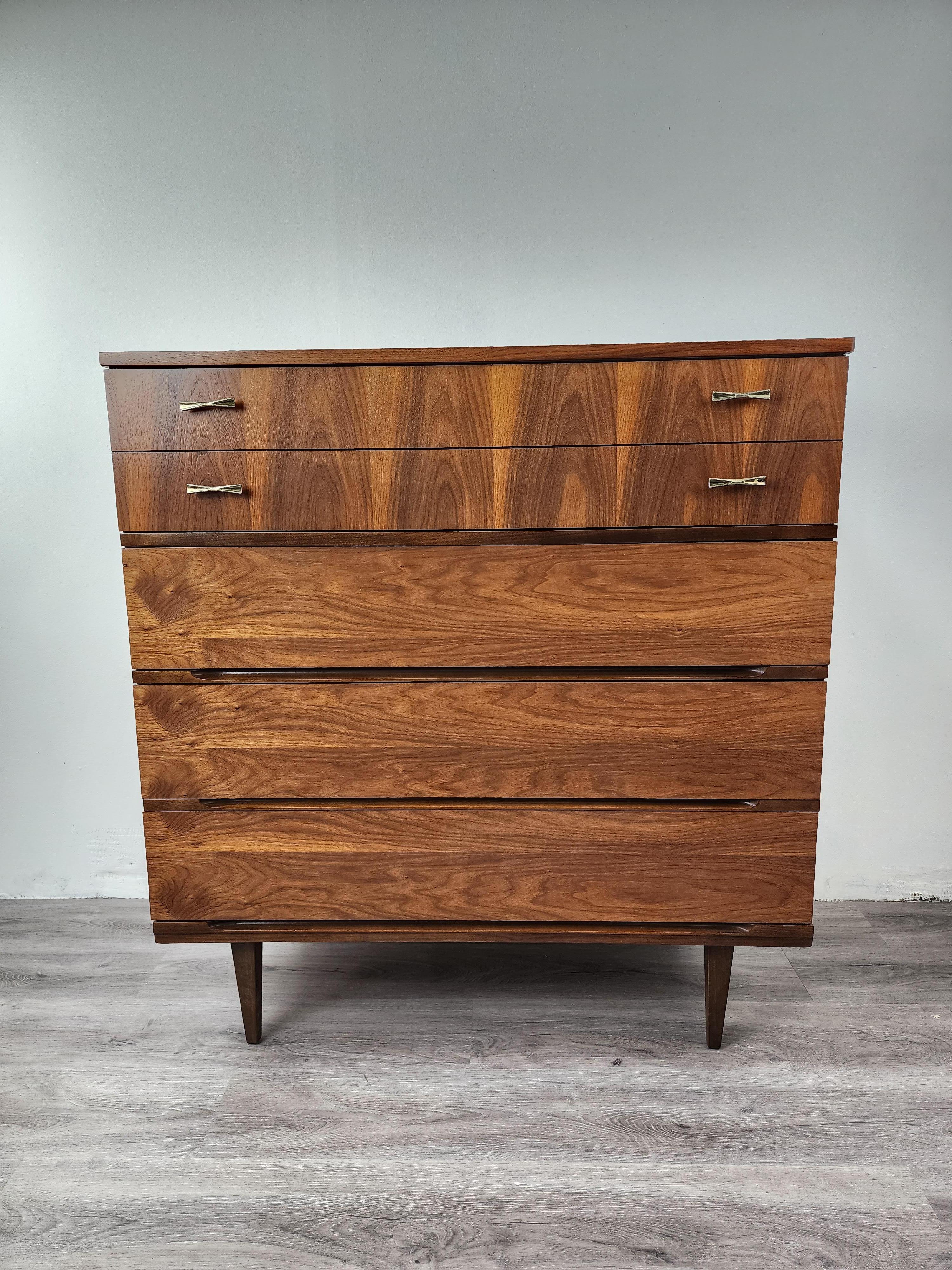 This walnut task chest was created by Harmony House in the 1960s. Purchased from the family of the original owner, this piece had been professionally refinished so it looks as good as the day it was first purchased. The grain on the vintage walnut