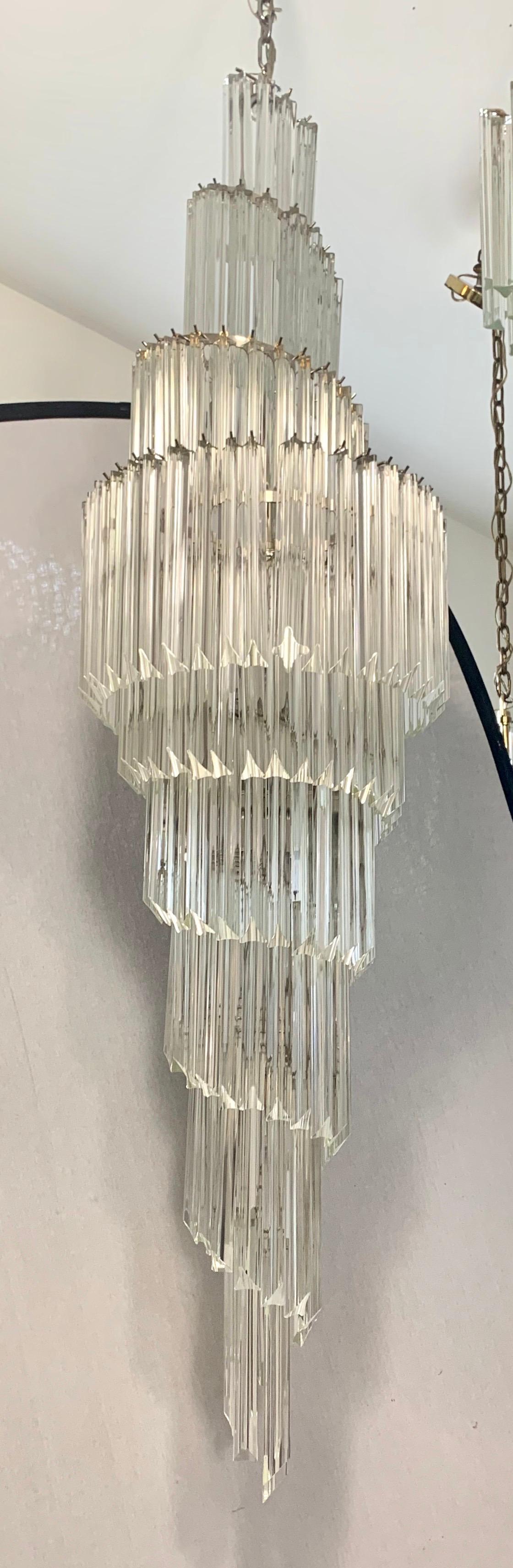 Measuring over six feet tall, this midcentury Camer glass foyer chandelier is guaranteed to make
a statement. Wired for USA and in perfect working order with multiple lights. Now, more than ever, home is where the heart is.