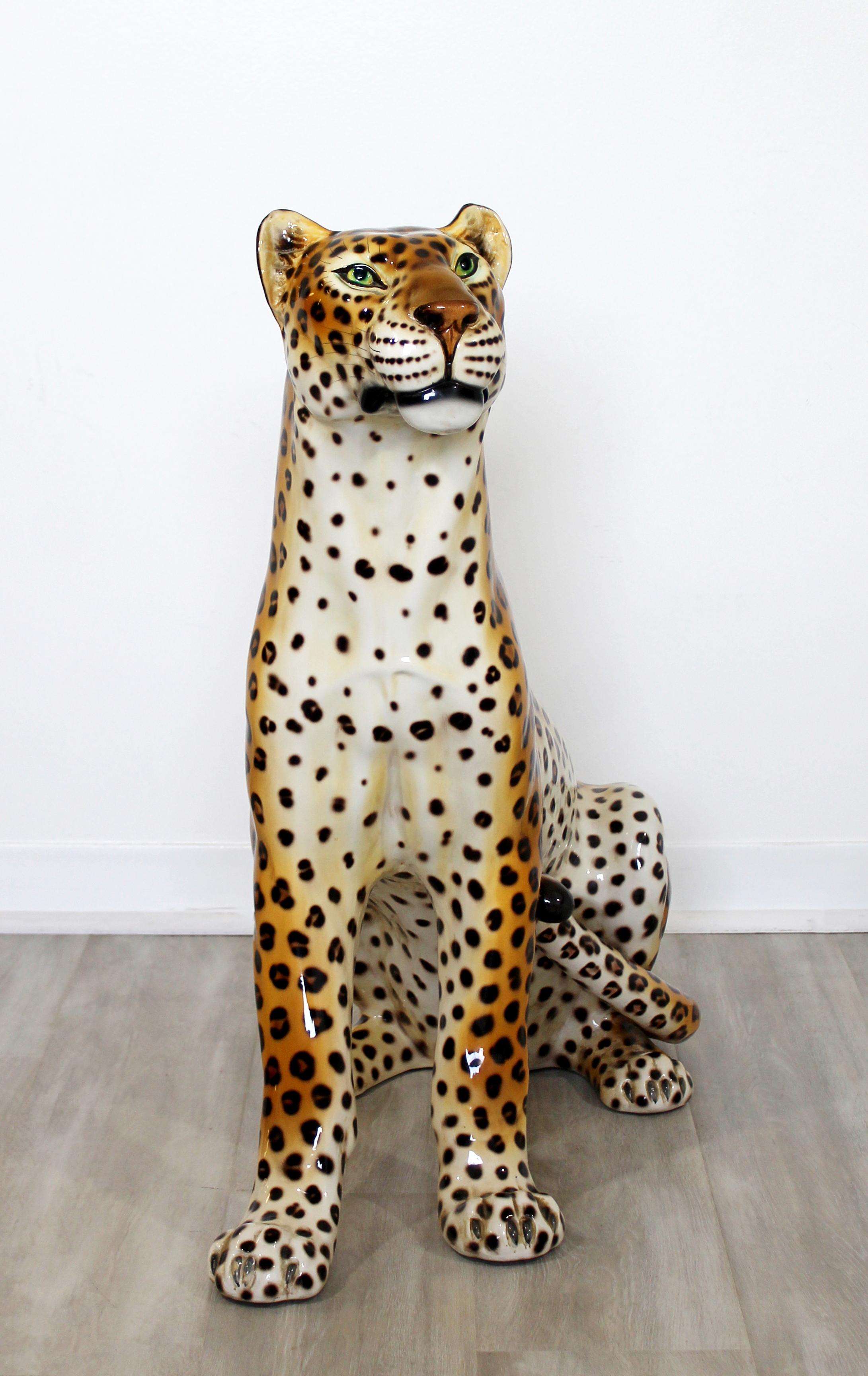 For your consideration is a gorgeous, life-sized, painted porcelain floor sculpture of a cheetah or leopard, circa the 1970s. In excellent vintage condition. The dimensions are 18