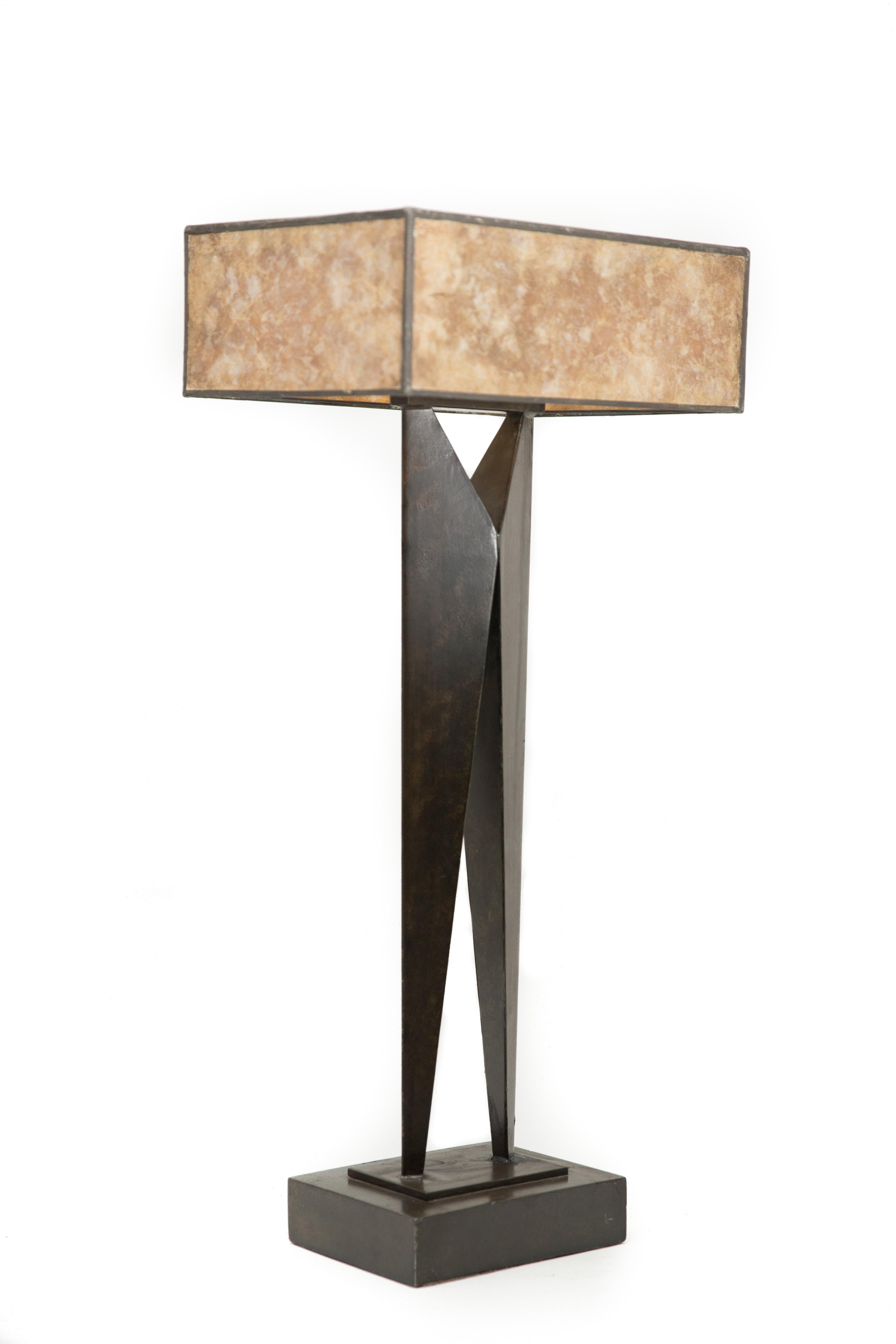 Offered is a circa 1970s sculpture modern design tall table lamp with the original Eisen glass Mica shade. The lamp stands 33.5” in height, is 15.25” in width and 11” in depth.