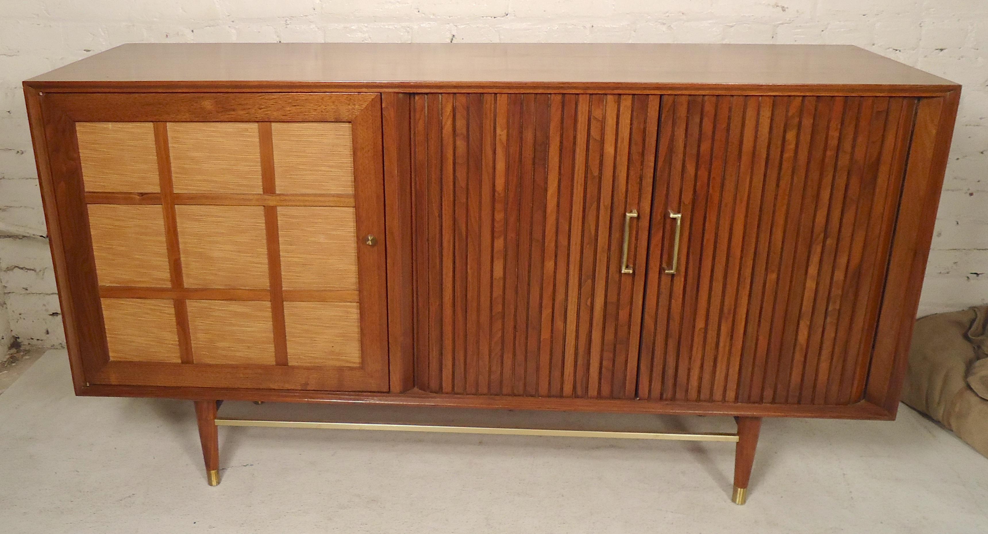 Vintage walnut cabinet with both open storage and drawers. Brass hardware, tambour door doors that recede into the back. Great for bedroom or living room.

(Please confirm item location - NY or NJ - with dealer).
 