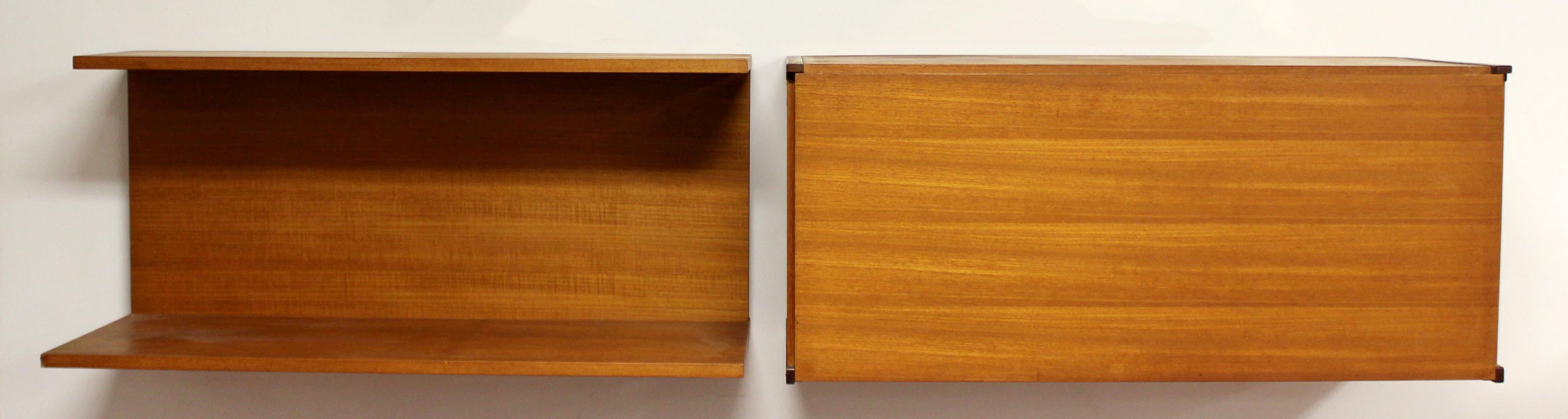 For your consideration is a gorgeous pair of teak, wall mounted pieces, a shelf and a bar unit, made in England by Beaver & Tapley, circa 1970s. In excellent vintage condition. The dimensions of each are 36