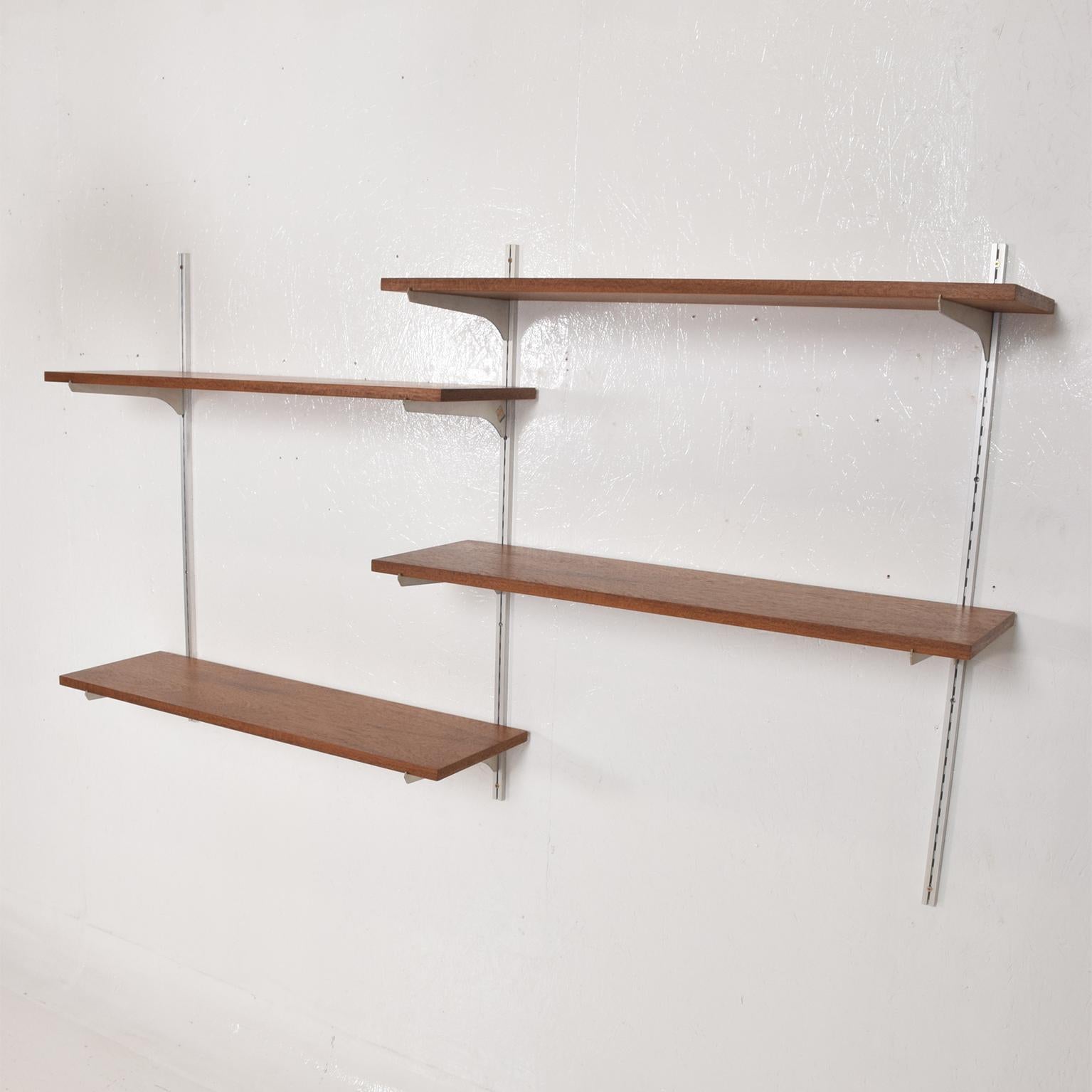 For your consideration, a Mid-Century Modern teak and aluminum wall unit shelving teak and aluminum.

Unmarked. The USA, circa 1960s. 

Dimensions: 36 1/2